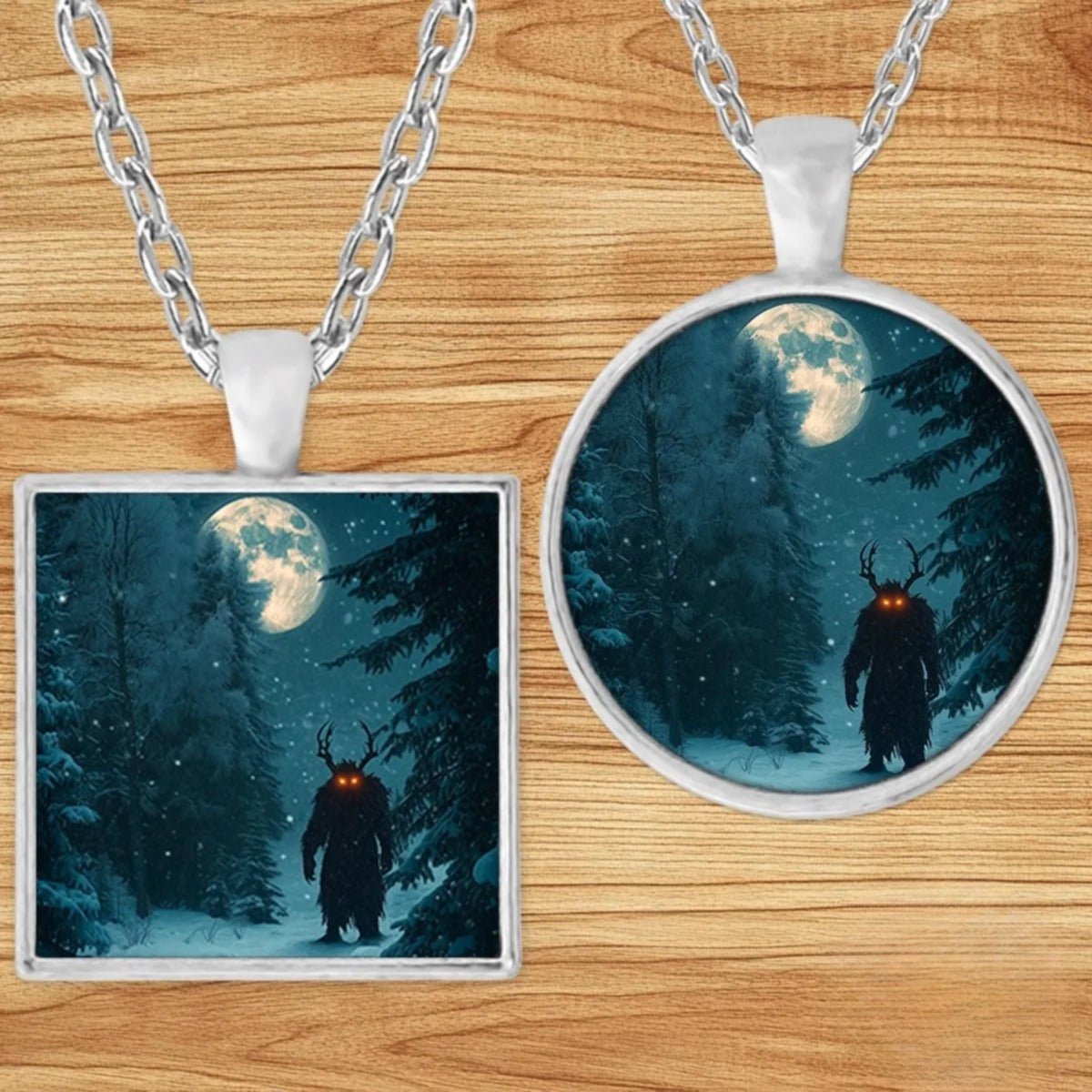 Horned Forest Cryptid pendant necklace shown in round and square silver charm styles on a wood background