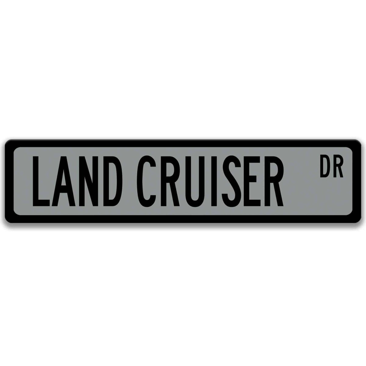 Gray street sign with black border, black text reading LAND CRUISER DR