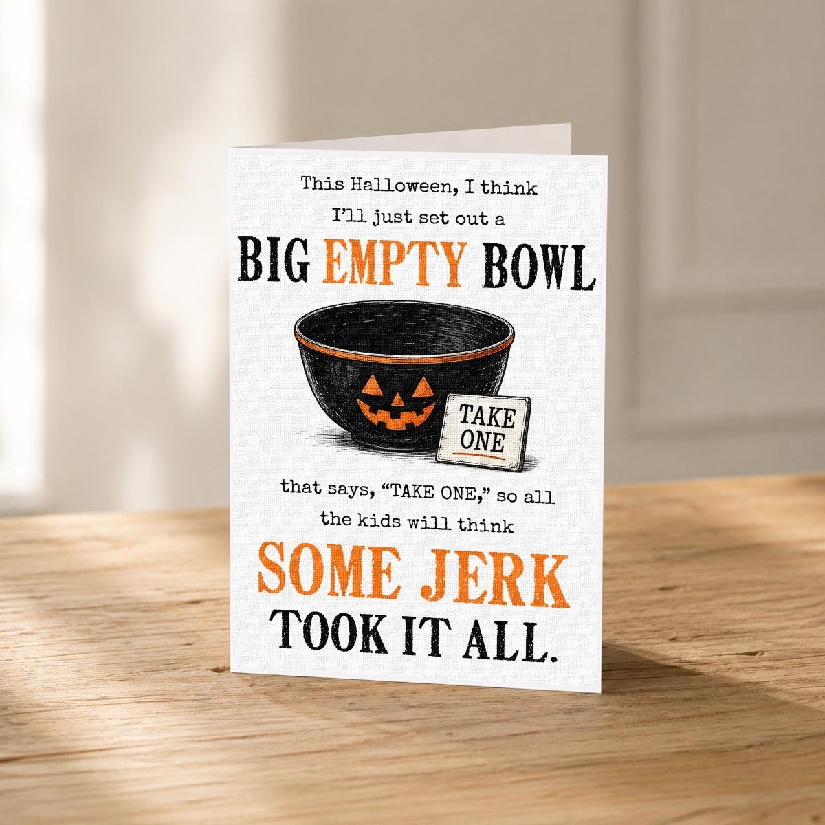 Close-up of the Empty Candy Bowl Funny Halloween Card showing the vintage black-and-orange design.