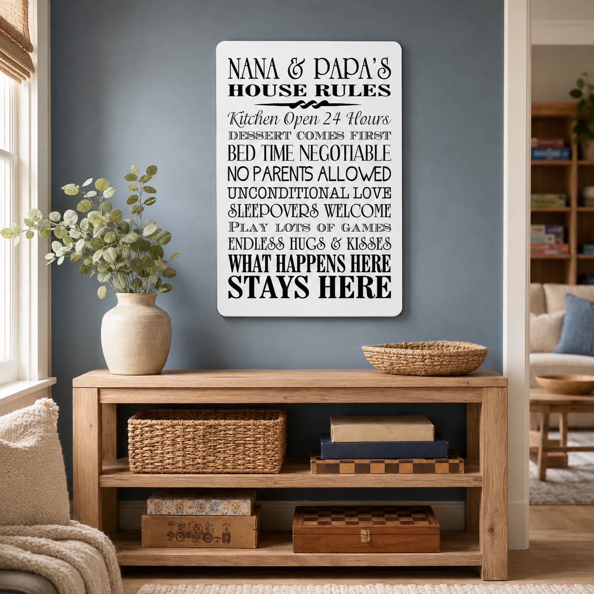 a living room with a wooden bookshelf, a potted plant, and a sign that lists the house rules for Nana and Papa.
