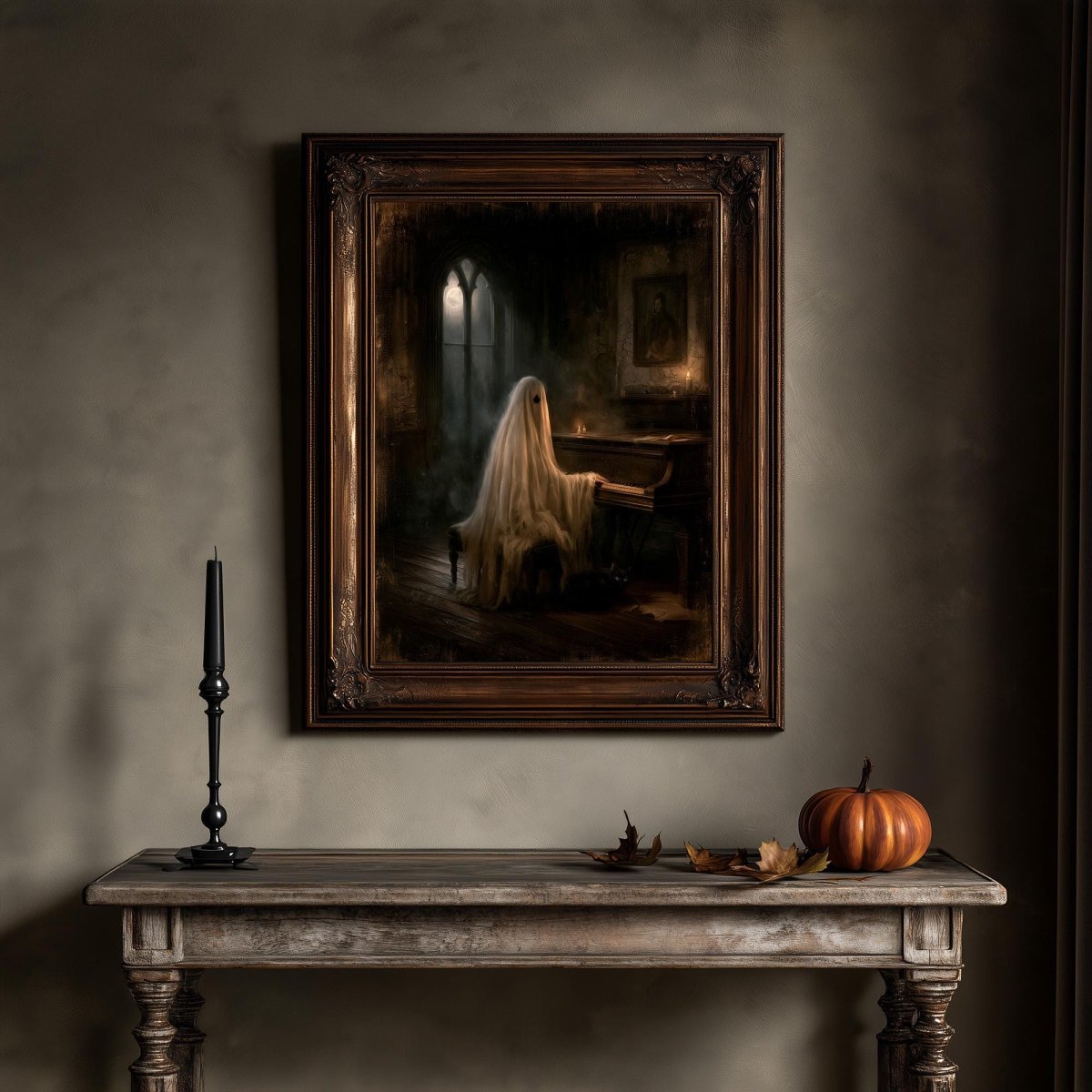Ghost at the piano print above a wooden table holding a candle and a small pumpkin