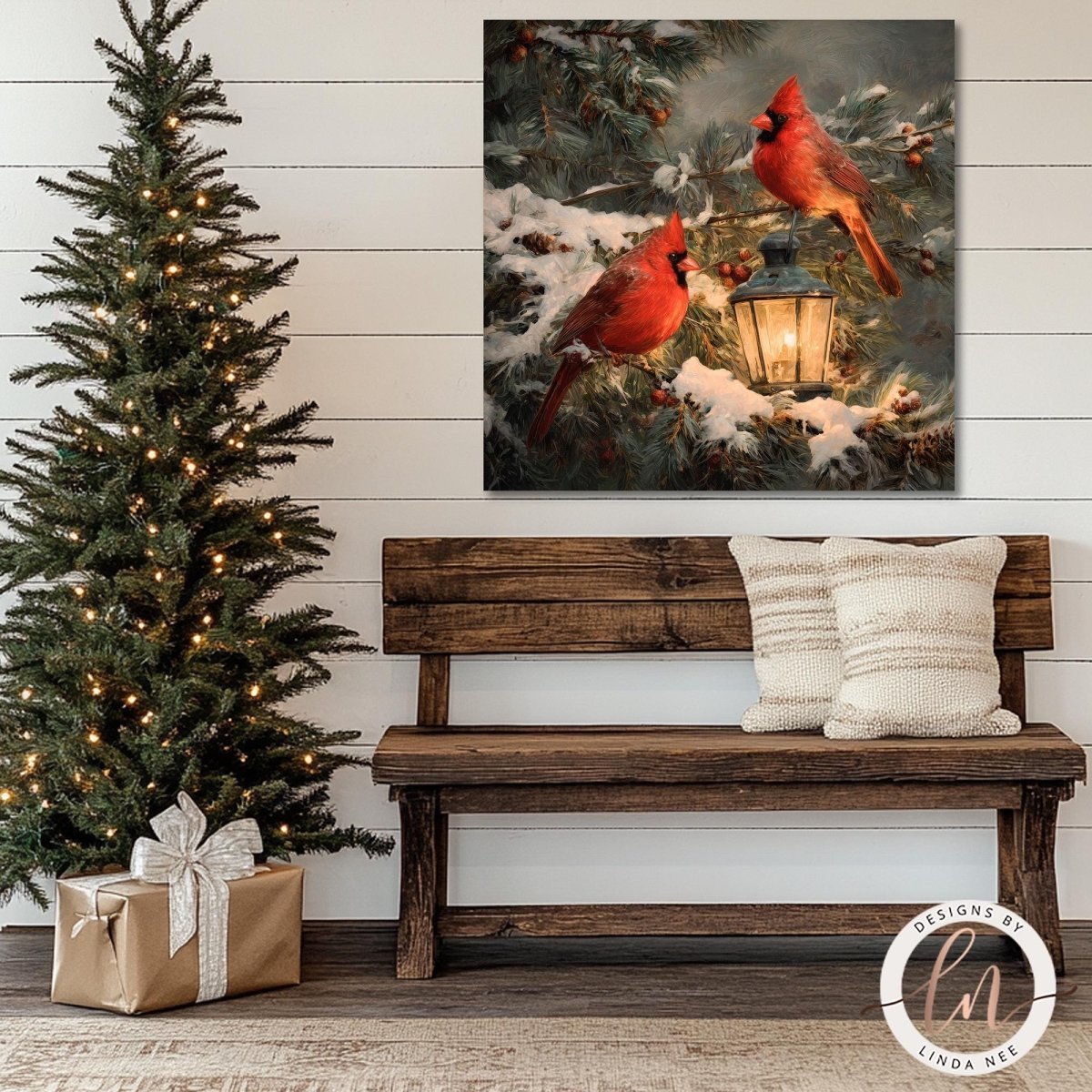 Cardinal lantern artwork shown above a rustic bench beside a lit tree