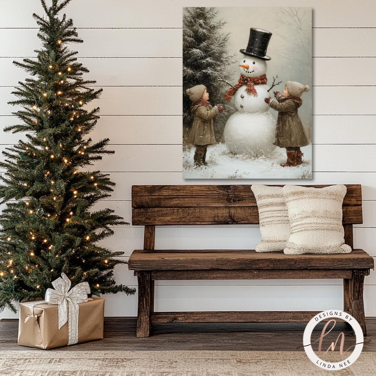 Children building a snowman artwork above a wooden bench beside a lit tree
