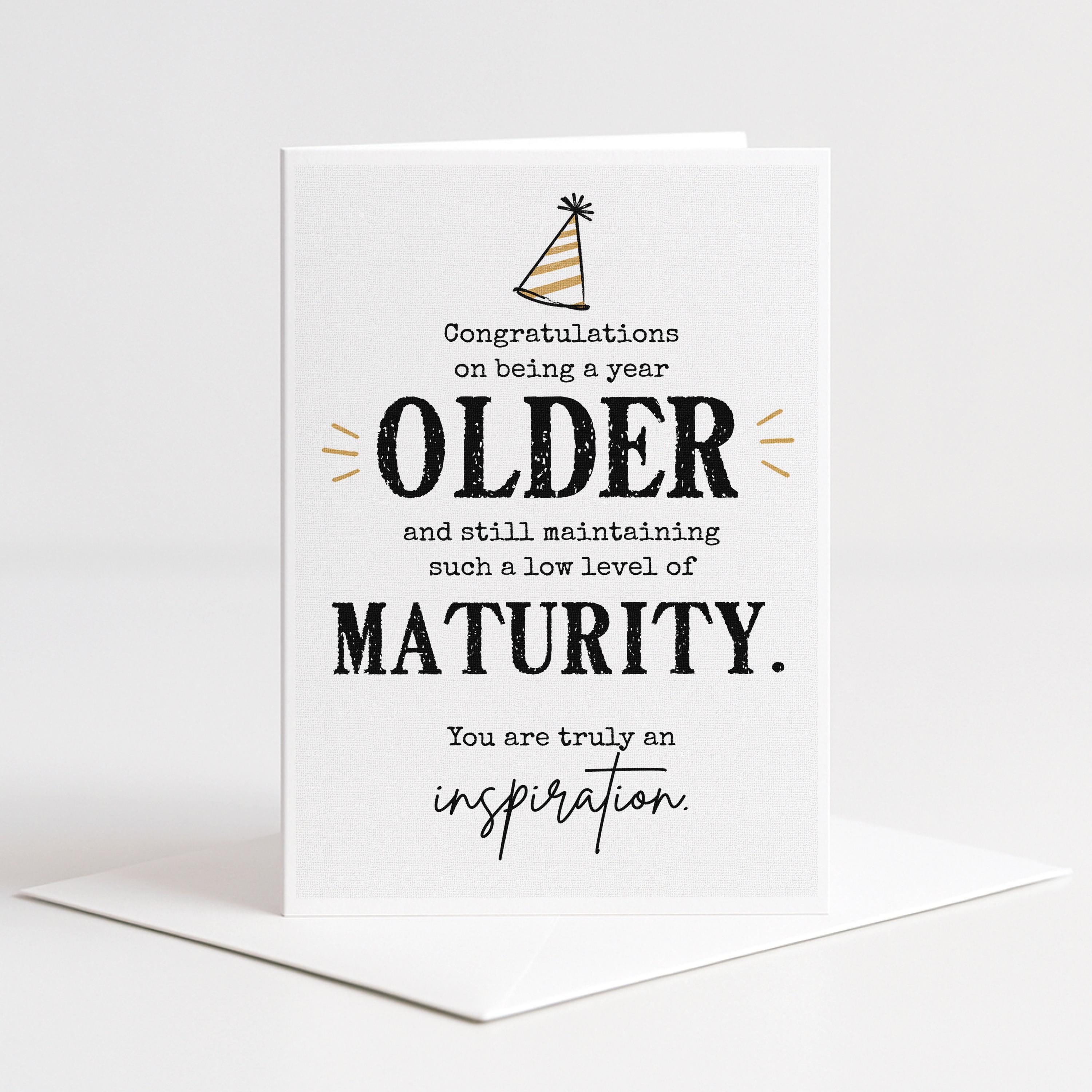 The image is a greeting card celebrating the achievements of an older person, congratulating them on being a year older and still maintaining a low level of maturity.