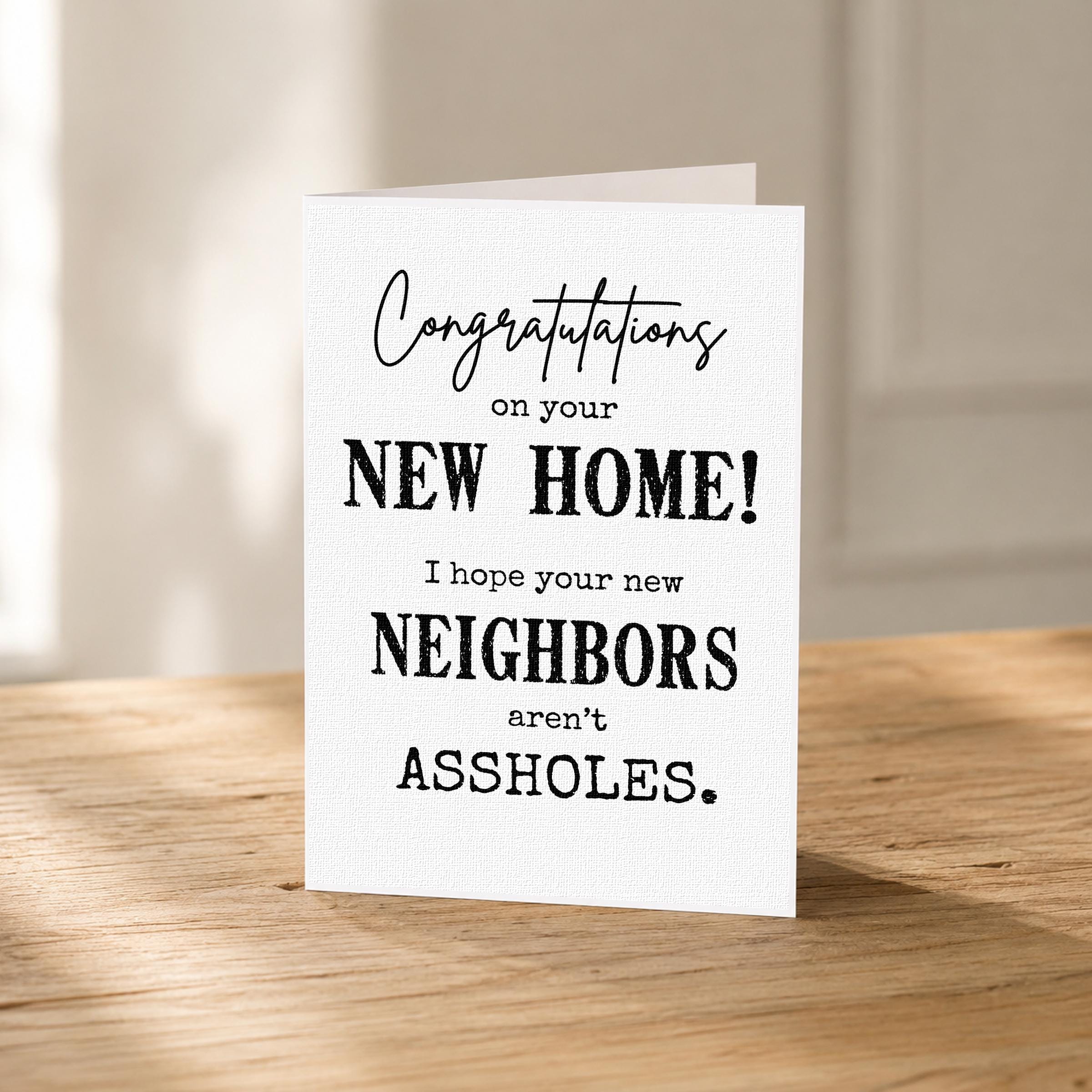 a humorous greeting card with the text "Congratulations on your new home! I hope your new neighbors aren't assholes."
