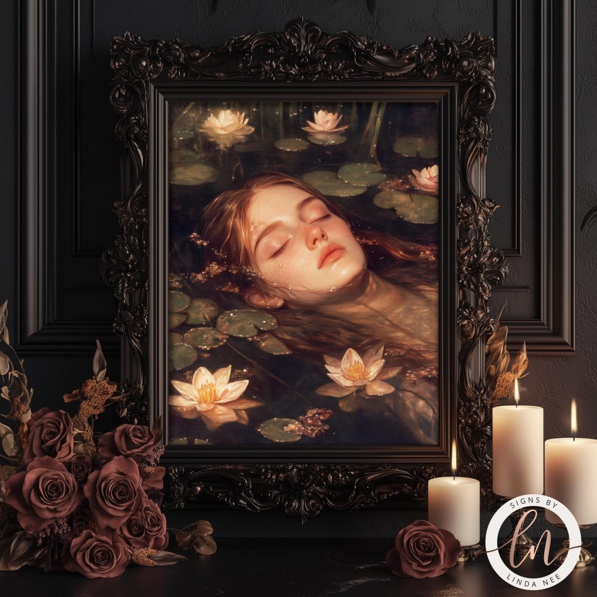 a painting of a woman's face with closed eyes, surrounded by lily pads and flowers, displayed in an ornate frame. The painting is set against a dark background, creating a sense of depth and contrast. The frame is placed on a table, with candles and roses adding to the overall aesthetic.