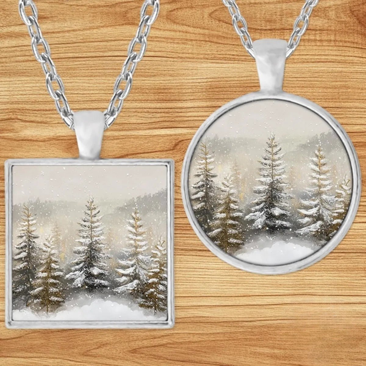 Snowy Pine Forest pendant necklace shown in round and square silver charm styles on a wood background