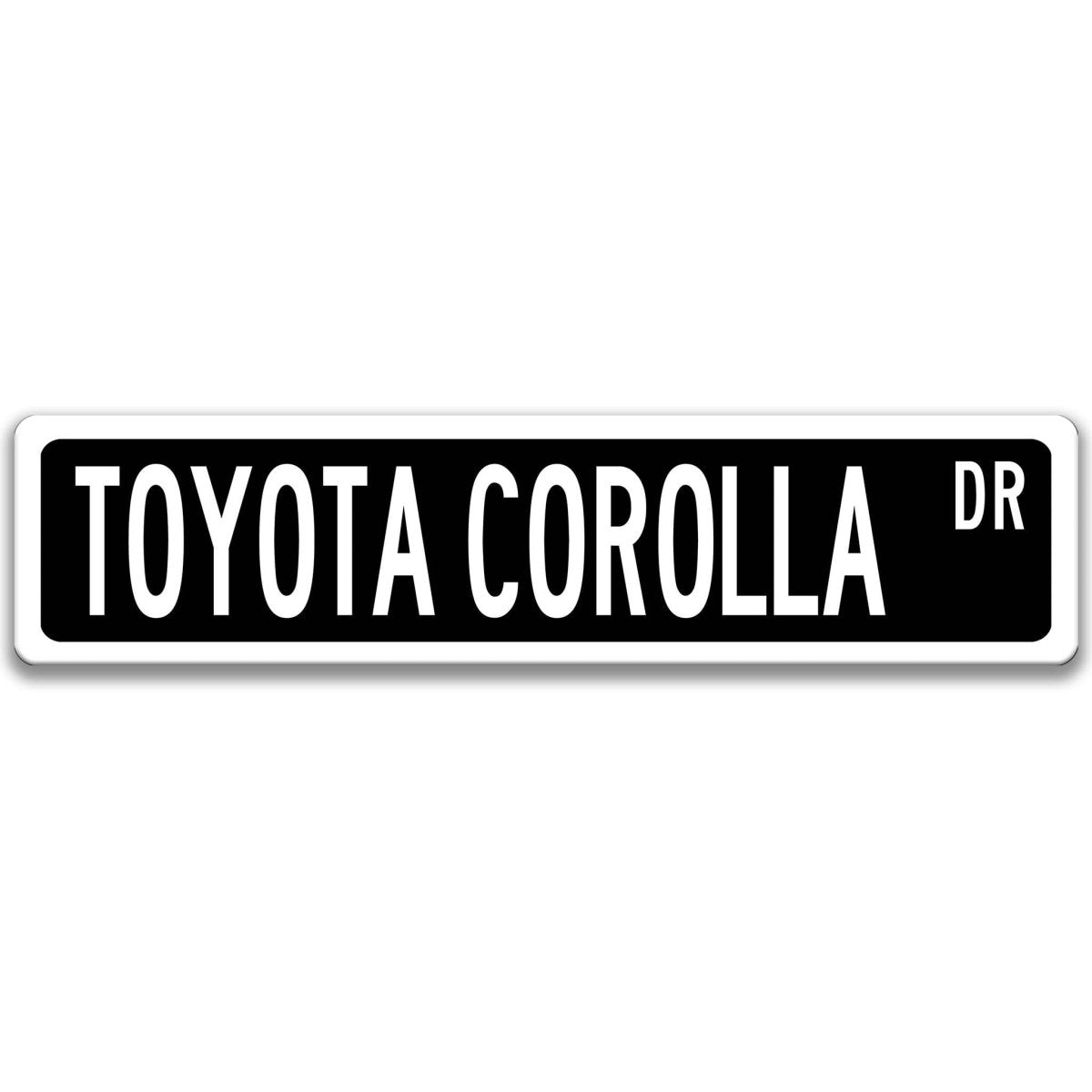 Black Toyota Corolla street sign with white border and white text reading TOYOTA COROLLA DR