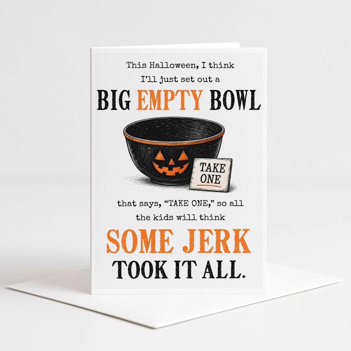 The image is a Halloween-themed greeting card with a black bowl and a jack-o-lantern design, accompanied by a humorous text that reads "This Halloween, I think I'll just set out a BIG EMPTY BOWL. TAKE ONE! so all the kids will think SOME JERK Took it all."