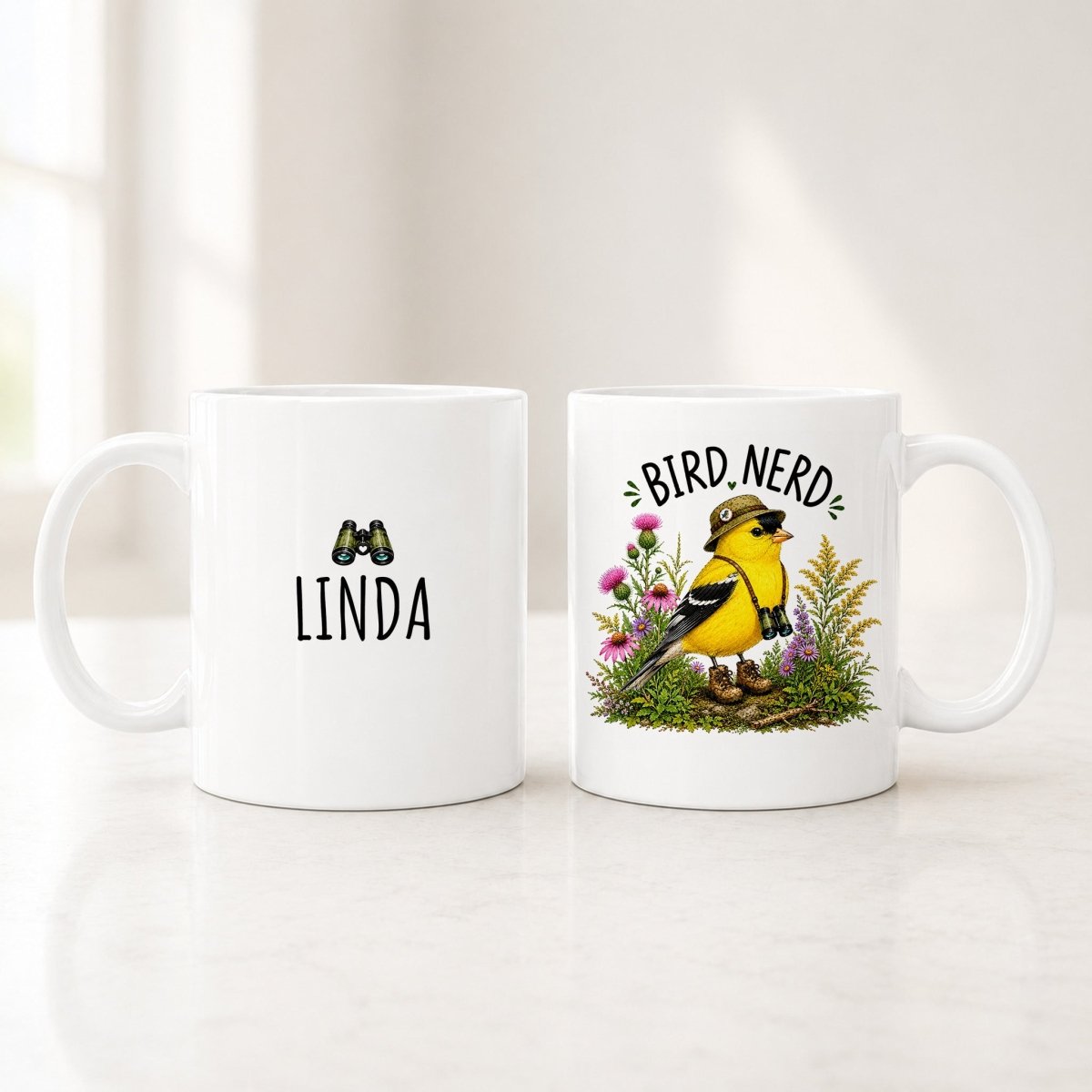 Both sides of the 11 oz personalized goldfinch mug, a custom name on the back and the Bird Nerd goldfinch in front