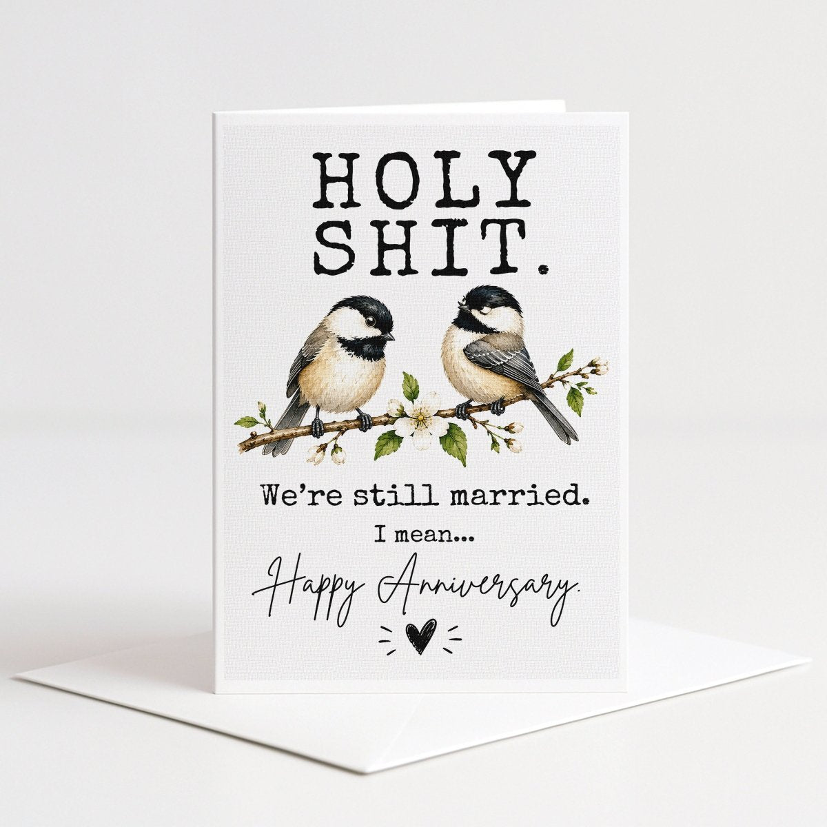 The image is a greeting card with a humorous message and an illustration of two birds perched on a branch.