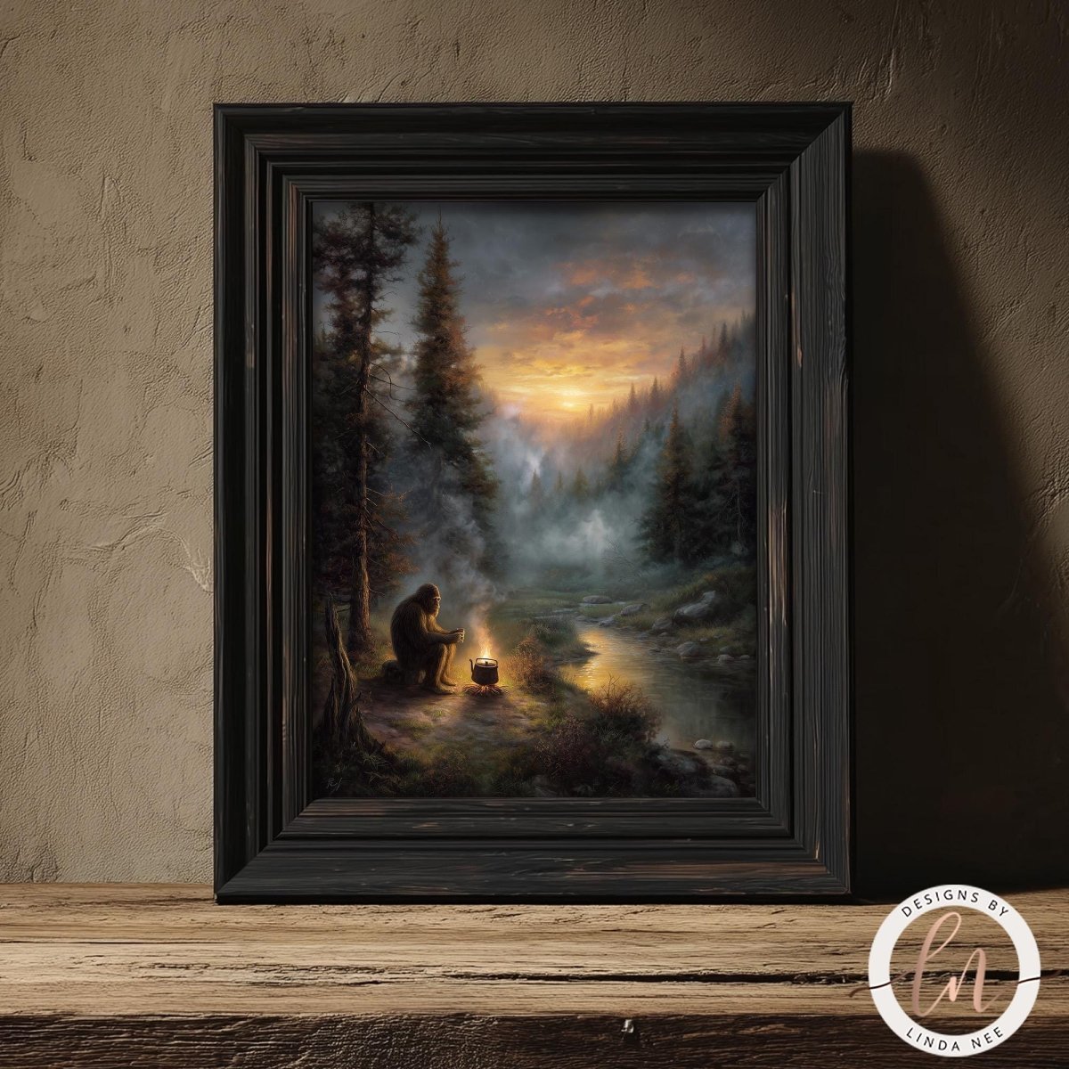 Fine art by Linda Nee featuring Bigfoot seated beside a glowing campfire in a misty evergreen forest at sunset, drinking coffee near a quiet river with moody woodland atmosphere.