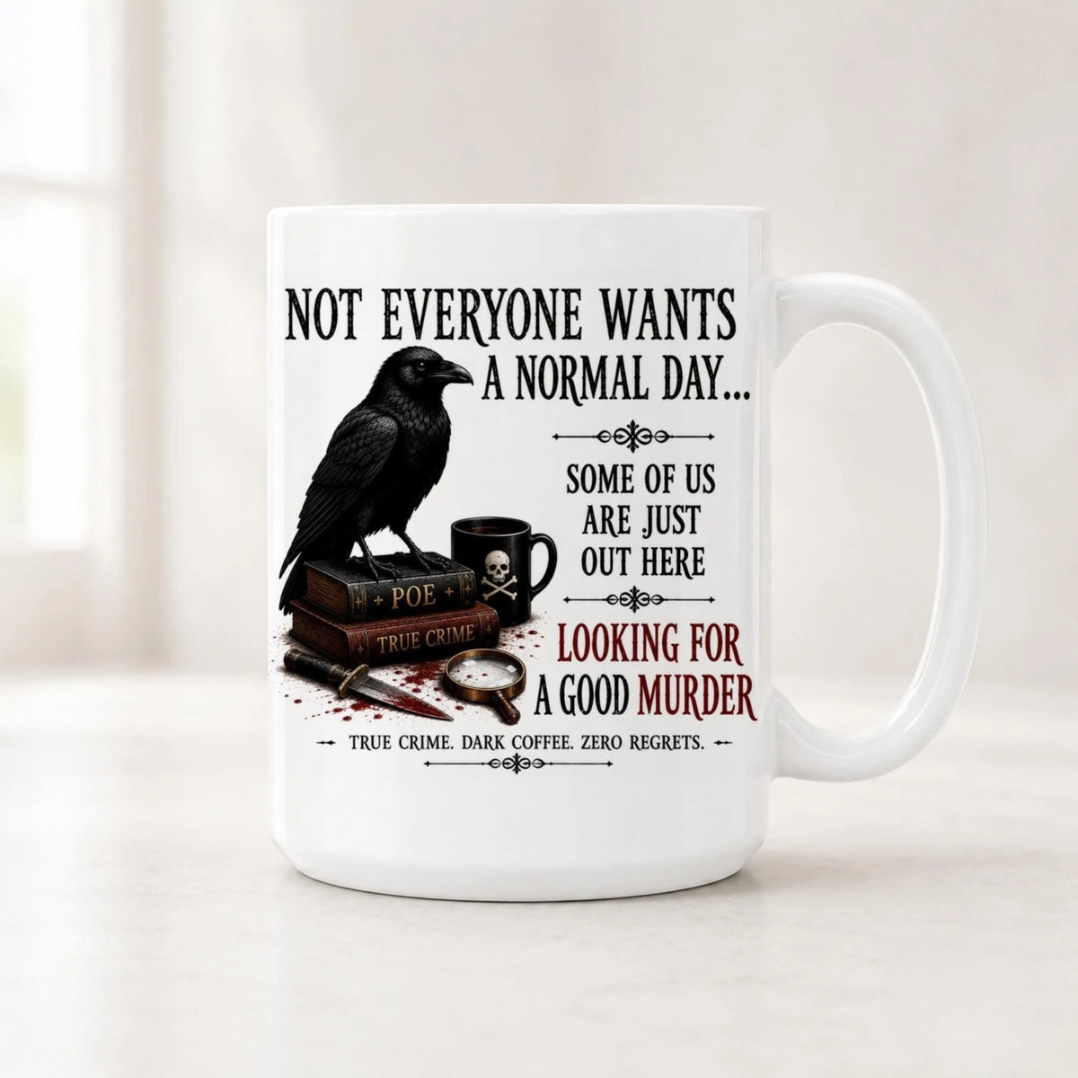 White raven mug with a black bird on Poe and True Crime books beside Looking for a Good Murder in black and red