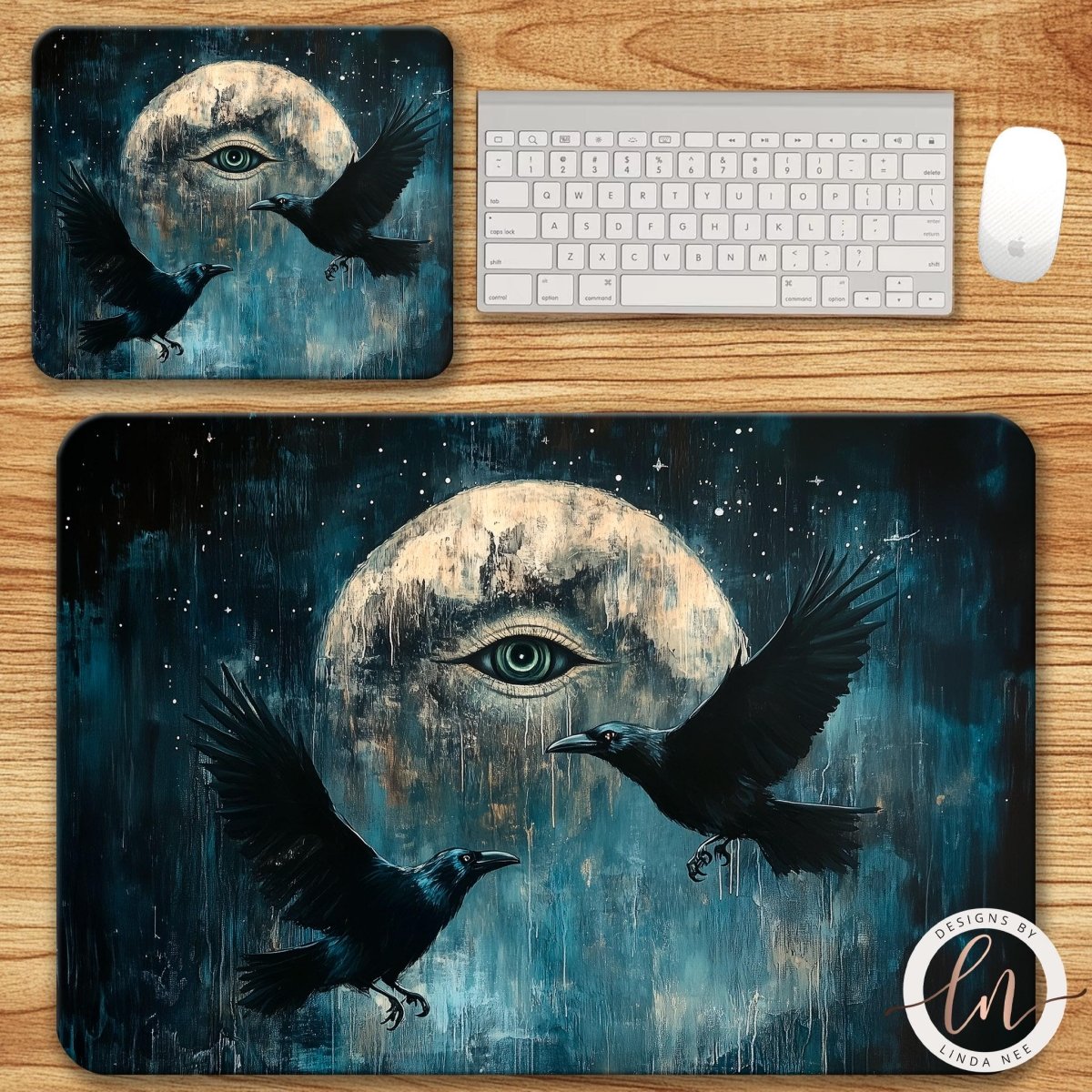 a mouse pad with a painting of two black crows flying towards a large, glowing moon.