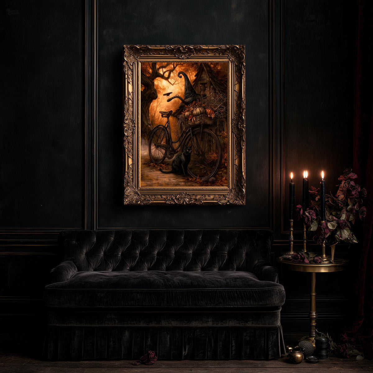 Large gothic wall art of the bicycle scene above a black tufted sofa in a dim room