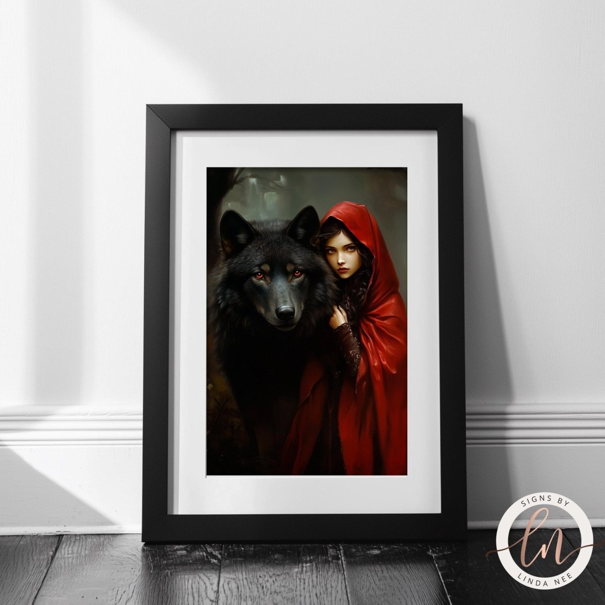 Close crop of a red hooded girl beside a black wolf in the forest