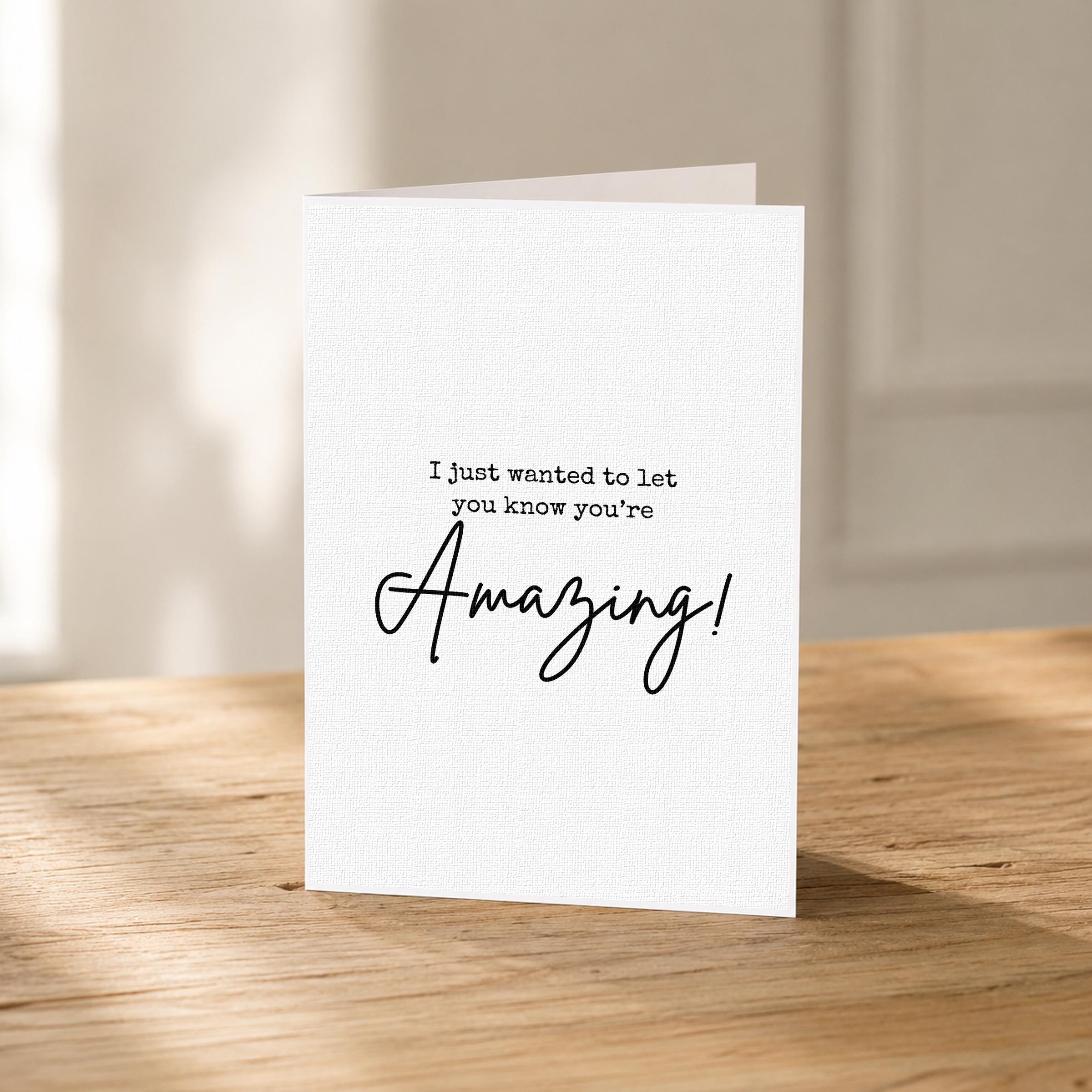 A white card with black text on it, placed on a wooden surface.
