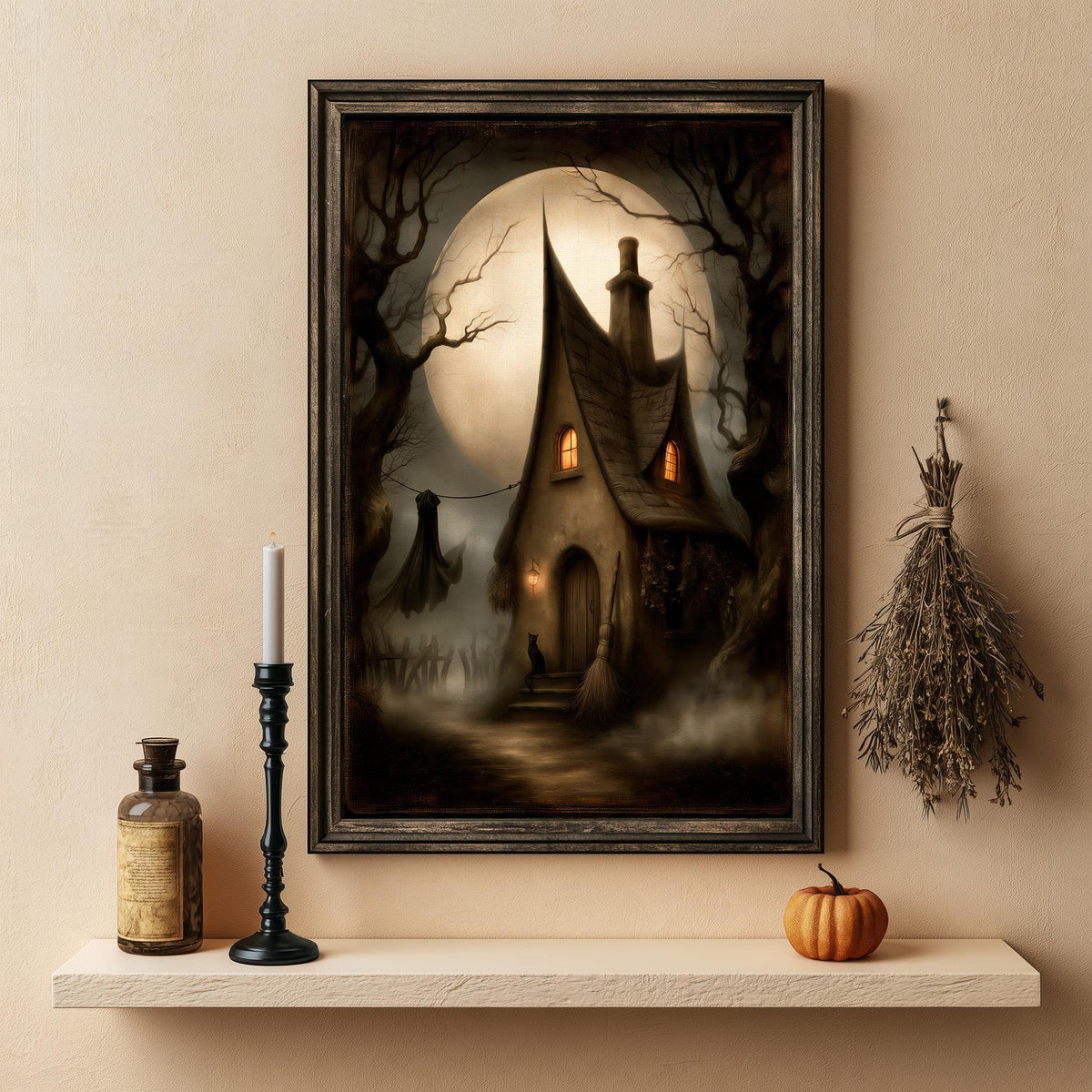Witch cottage print above a shelf with a candle, a bottle, and a small pumpkin