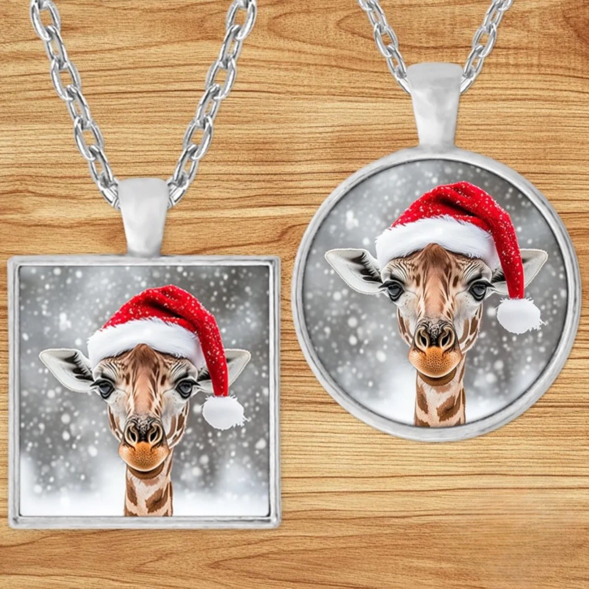 Christmas Giraffe Santa Hat pendant necklace shown in round and square silver charm styles on a wood background