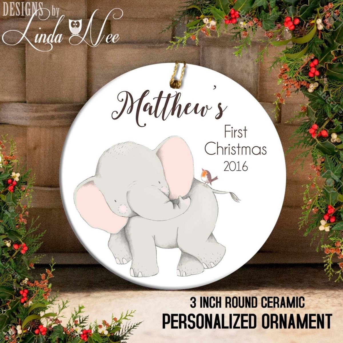 A round ceramic ornament featuring a gray elephant and a bird, with the text "Matthew's First Christmas 2016" and "3 INCH ROUND CERamic PERSONALIZED ORNAMENT" printed on it.