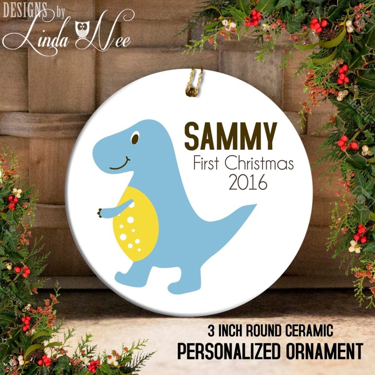 a ceramic ornament with a cartoon dinosaur, specifically a blue T-Rex, and the text "SAMMY First Christmas 2016" printed on it. The ornament is described as a 3-inch round ceramic personalized ornament.