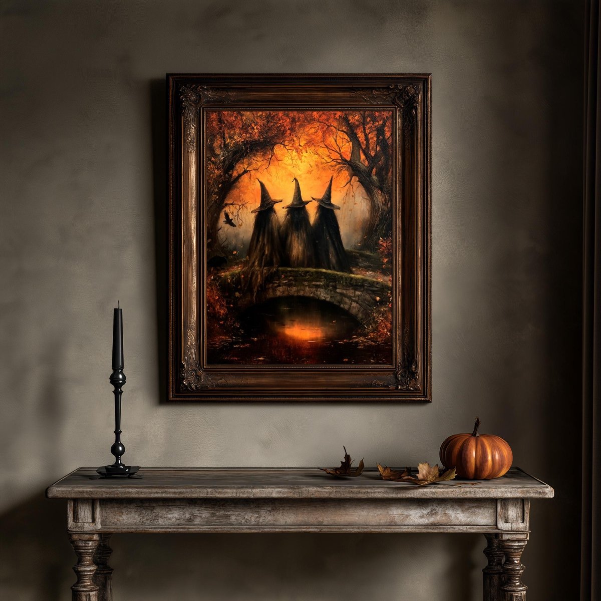 Witches on a stone bridge fall wall art above a pumpkin and candle
