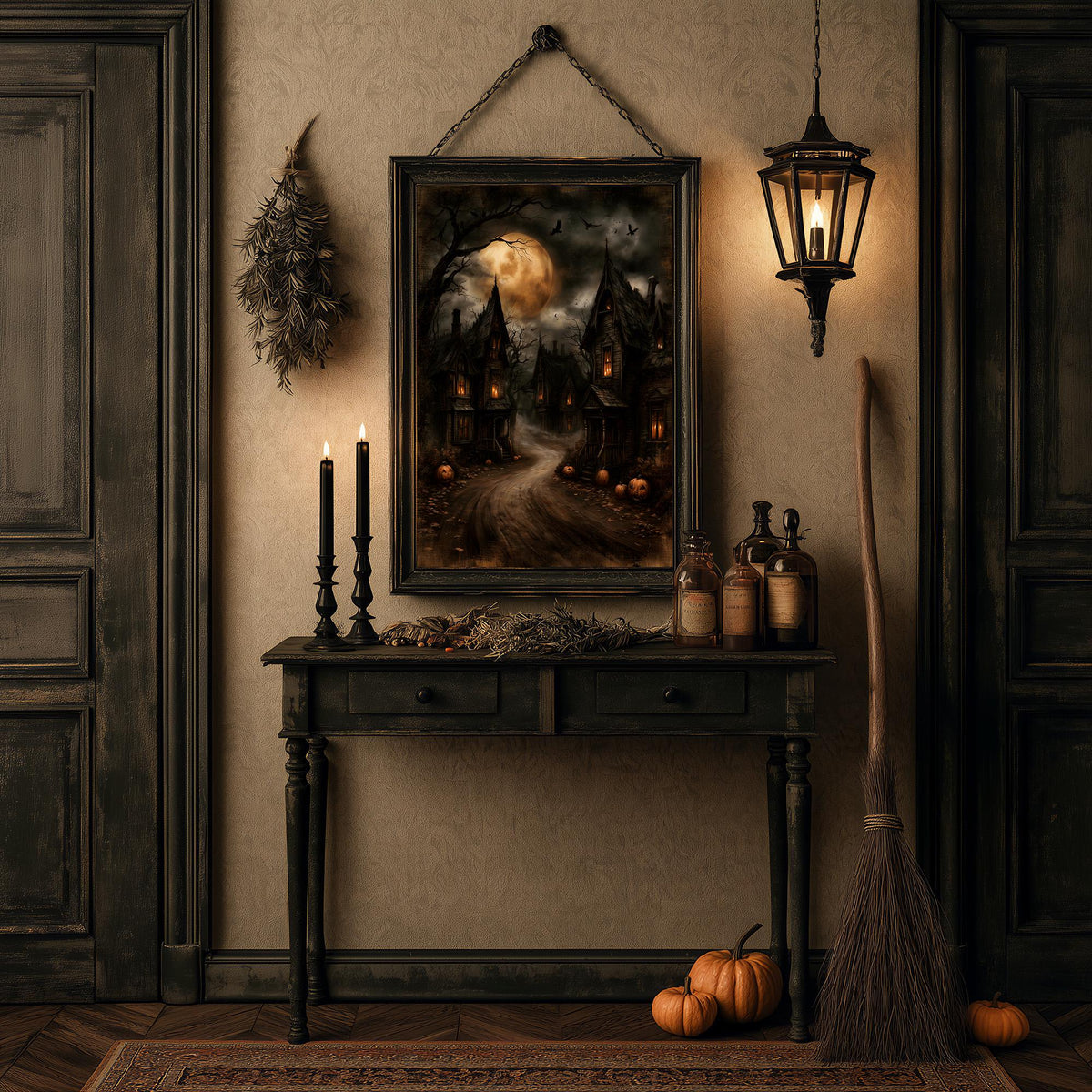 Halloween table of candles, pumpkins, and a broom under the gothic town print