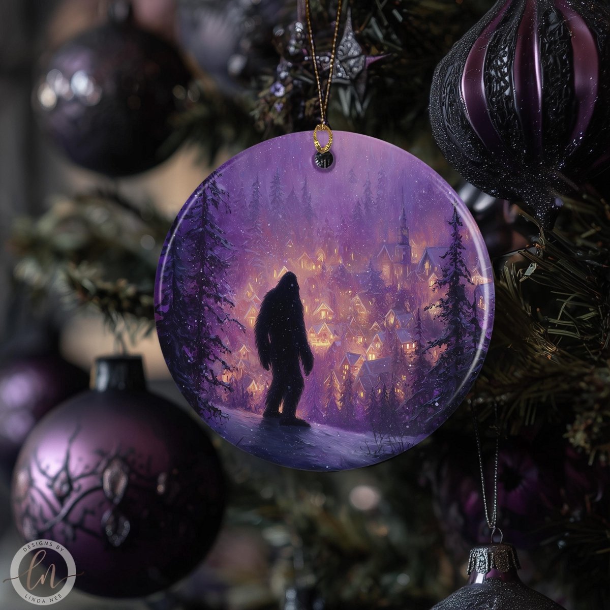a Christmas tree decorated with various ornaments, including a large purple ornament with a painting of a person in the woods.