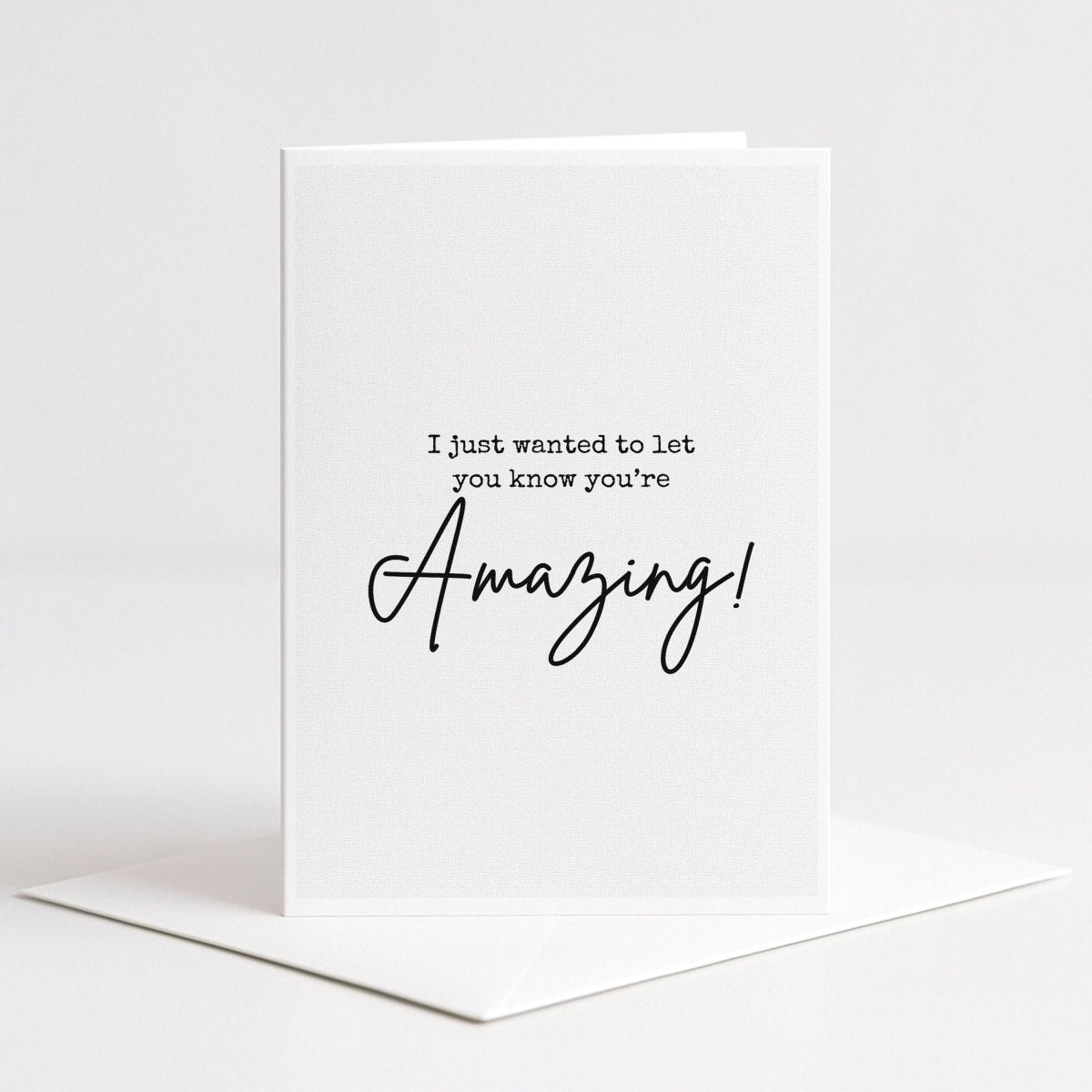 The image is a white card with a message written on it.