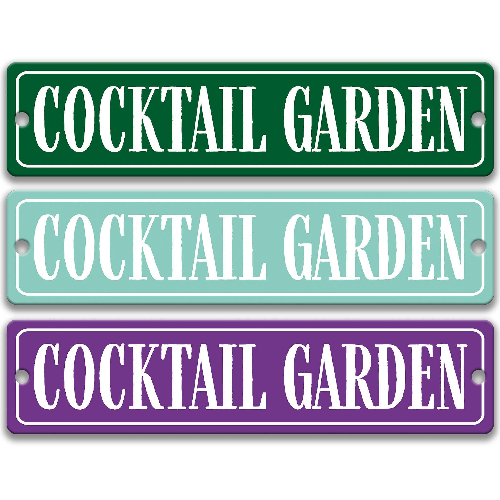 three rectangular signs with the text "Cocktail Garden" written on them in different colors.