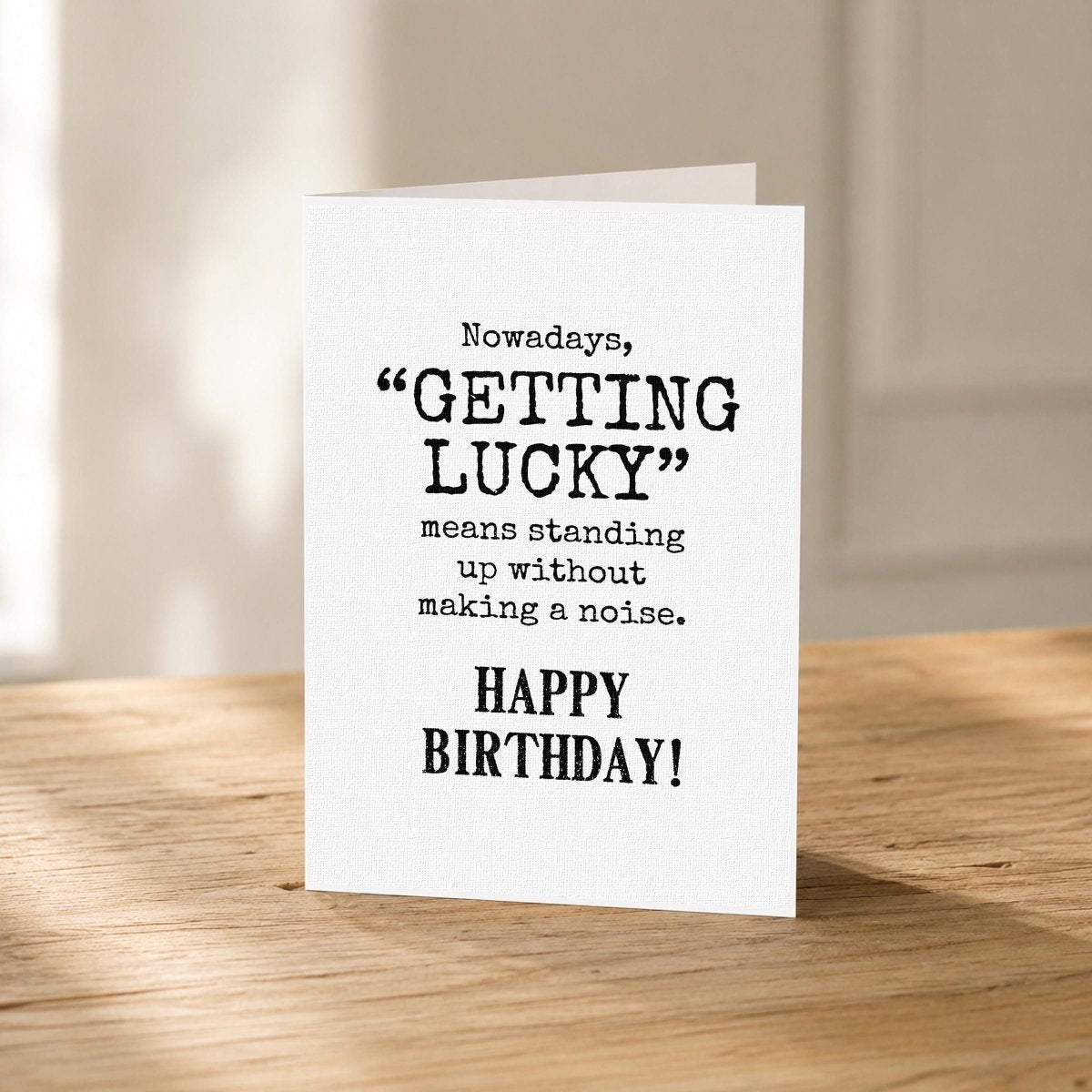 Close-up of the Old Age Joke Funny Birthday Card for Men showing the classic black typography.