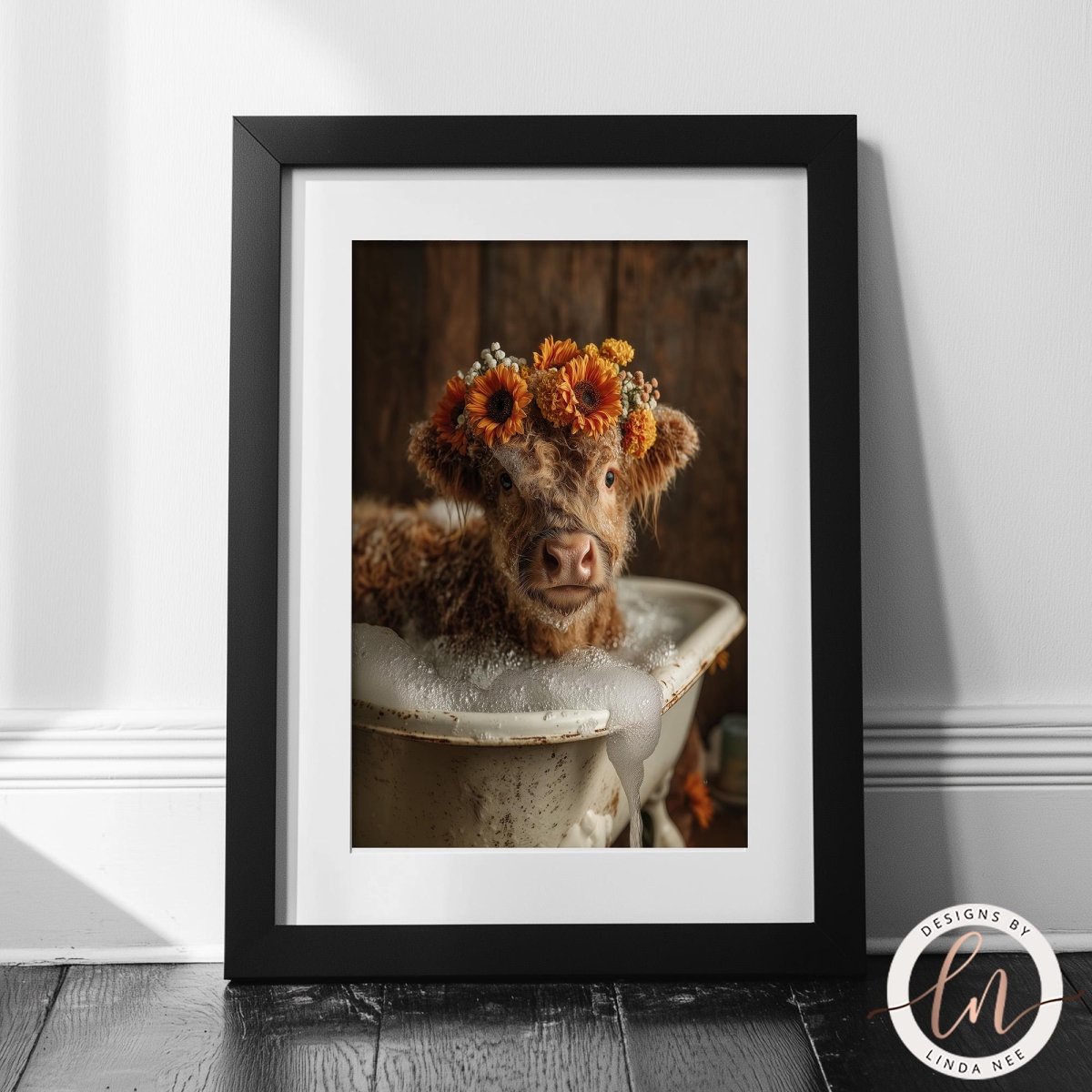 A framed photograph of a cow wearing a flower crown, sitting in a bathtub filled with bubbles.