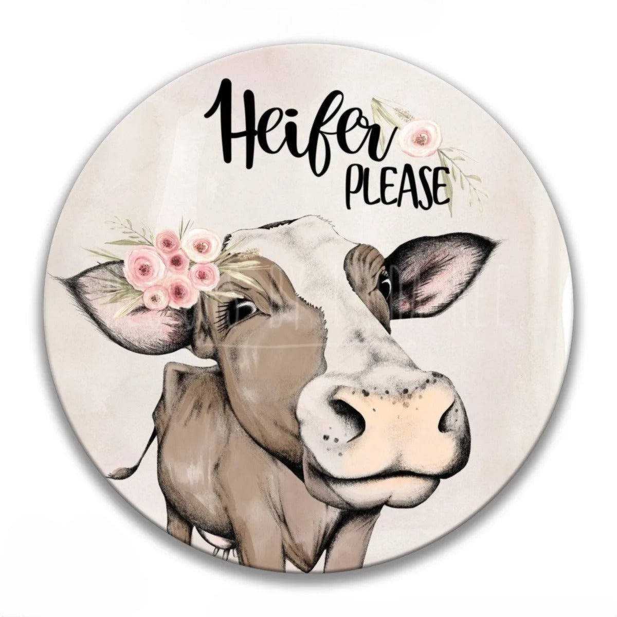Cute Heifer Please round metal sign, cow illustration with floral accents, angled view