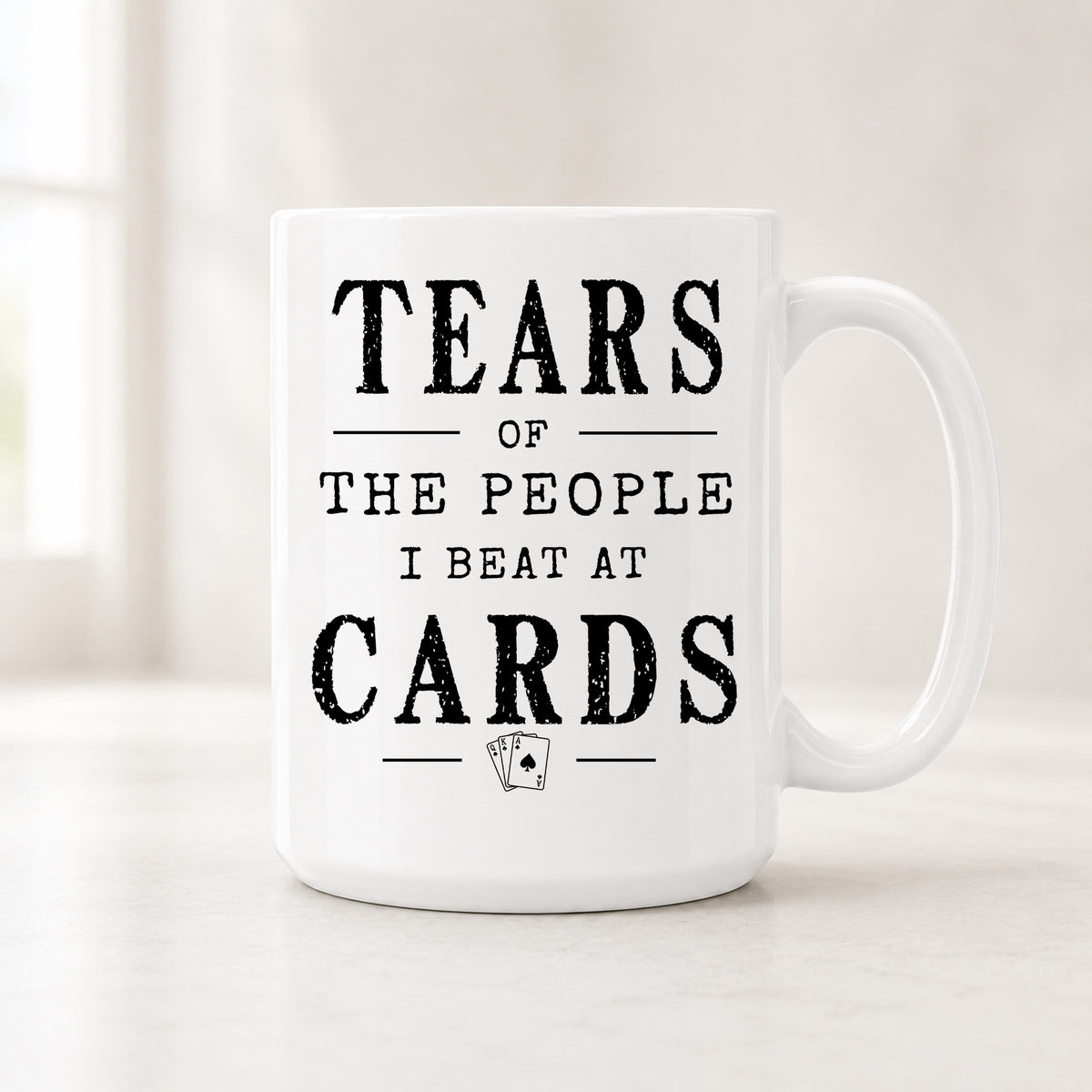 15 oz Tears of the People I Beat at Cards mug with bold black vintage lettering and a small themed icon