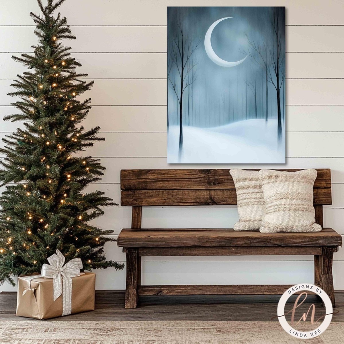 Winter moon wall art hung above a wooden bench with pillows