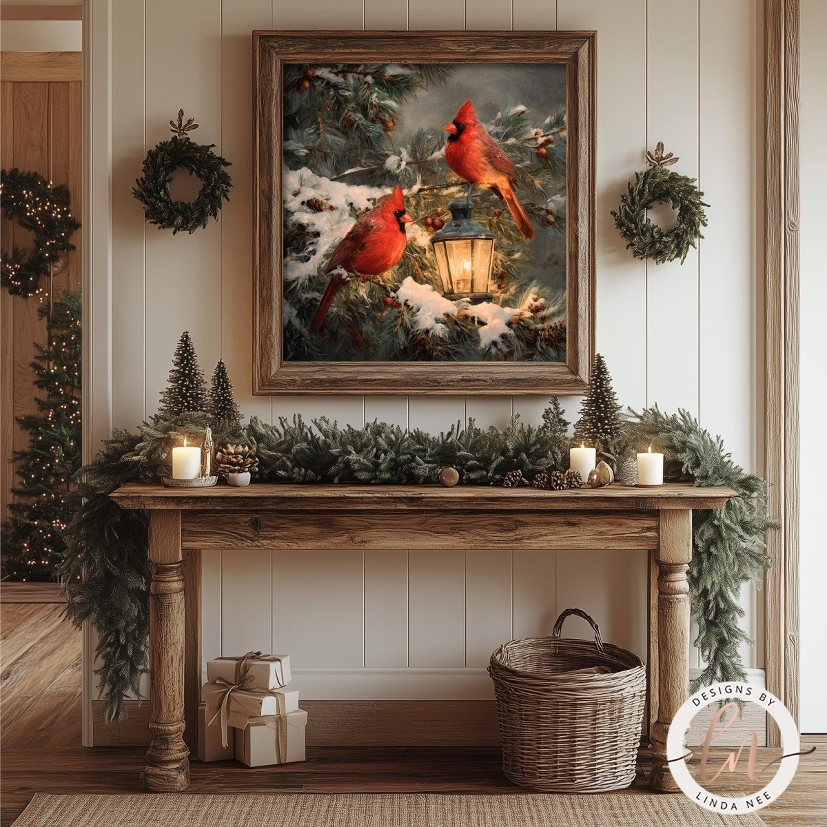a cozy and festive Christmas scene with a framed painting of two red cardinals perched on a branch, surrounded by pine trees and snow. The painting is hung on a wall above a wooden console table, which is adorned with a wreath, candles, and wrapped gifts. The overall atmosphere of the image is warm and inviting, with the natural elements of the painting and the holiday decorations creating a harmonious and visually appealing composition.