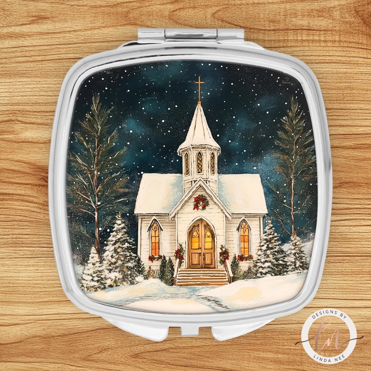 A white church with a cross on top, surrounded by snow-covered trees and a starry night sky, is depicted in the image.