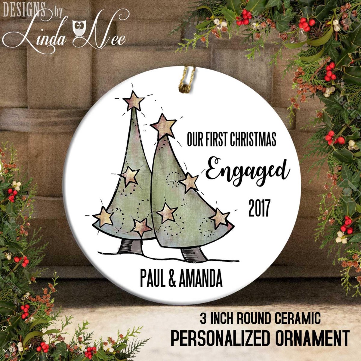 A round ceramic ornament with a Christmas tree design and text that reads "Our first Christmas Engaged 2017 Paul & Amanda 3 inch round ceramic personalized ornament".