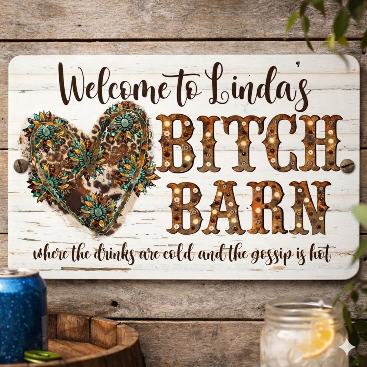 A wooden sign with a decorative heart-shaped design and text that reads "Welcome to Linda's Bitch Barn" and "where the drinks are cold and the gossip is hot".