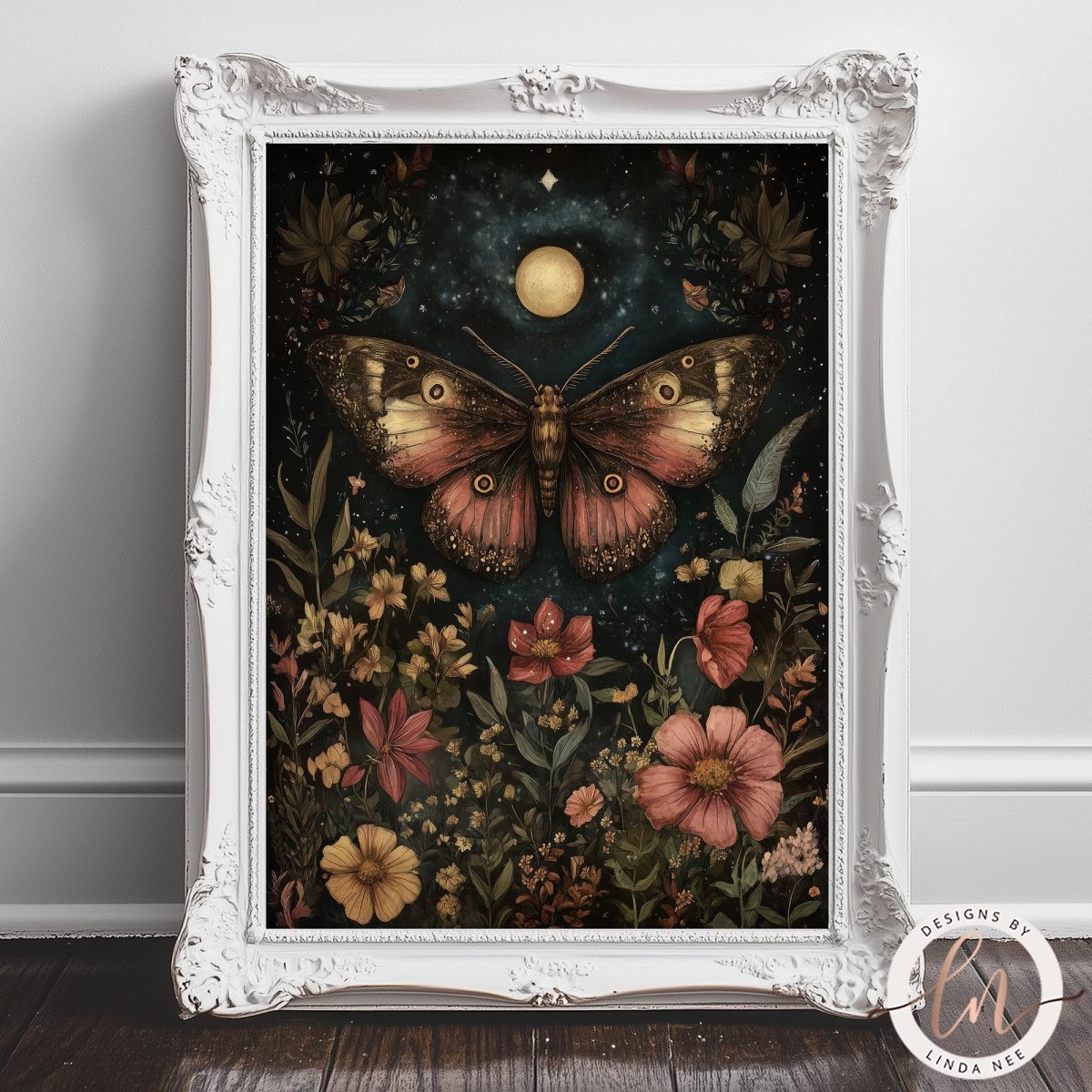 A framed art print featuring a whimsical night scene with a large butterfly over a field of flowers under a full moon, displayed in an ornate white frame against a light gray wall.