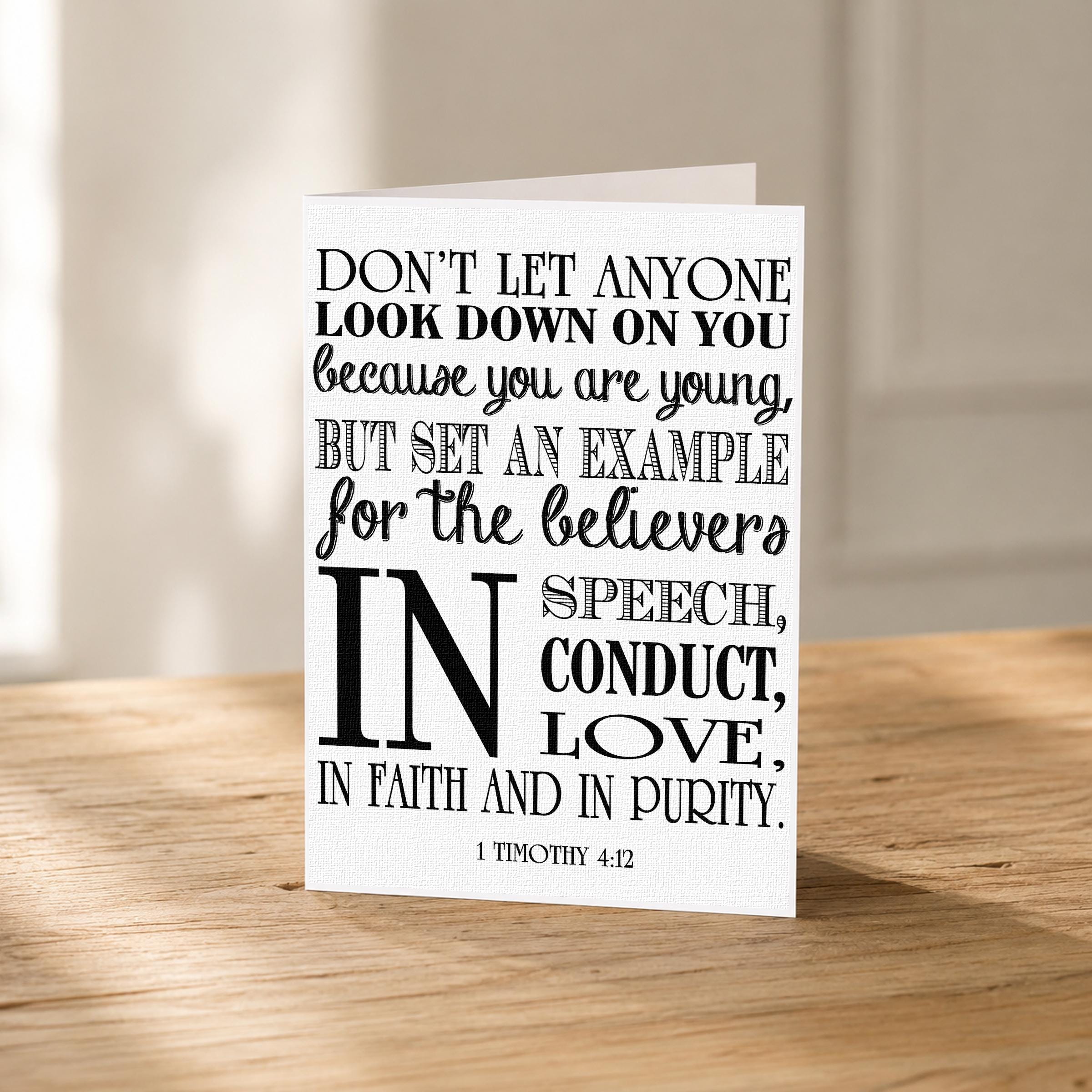 a card with a quote from 1 Timothy 4:12, which encourages the speaker to set an example for the believers and to speak, conduct, and love in faith and in purity.