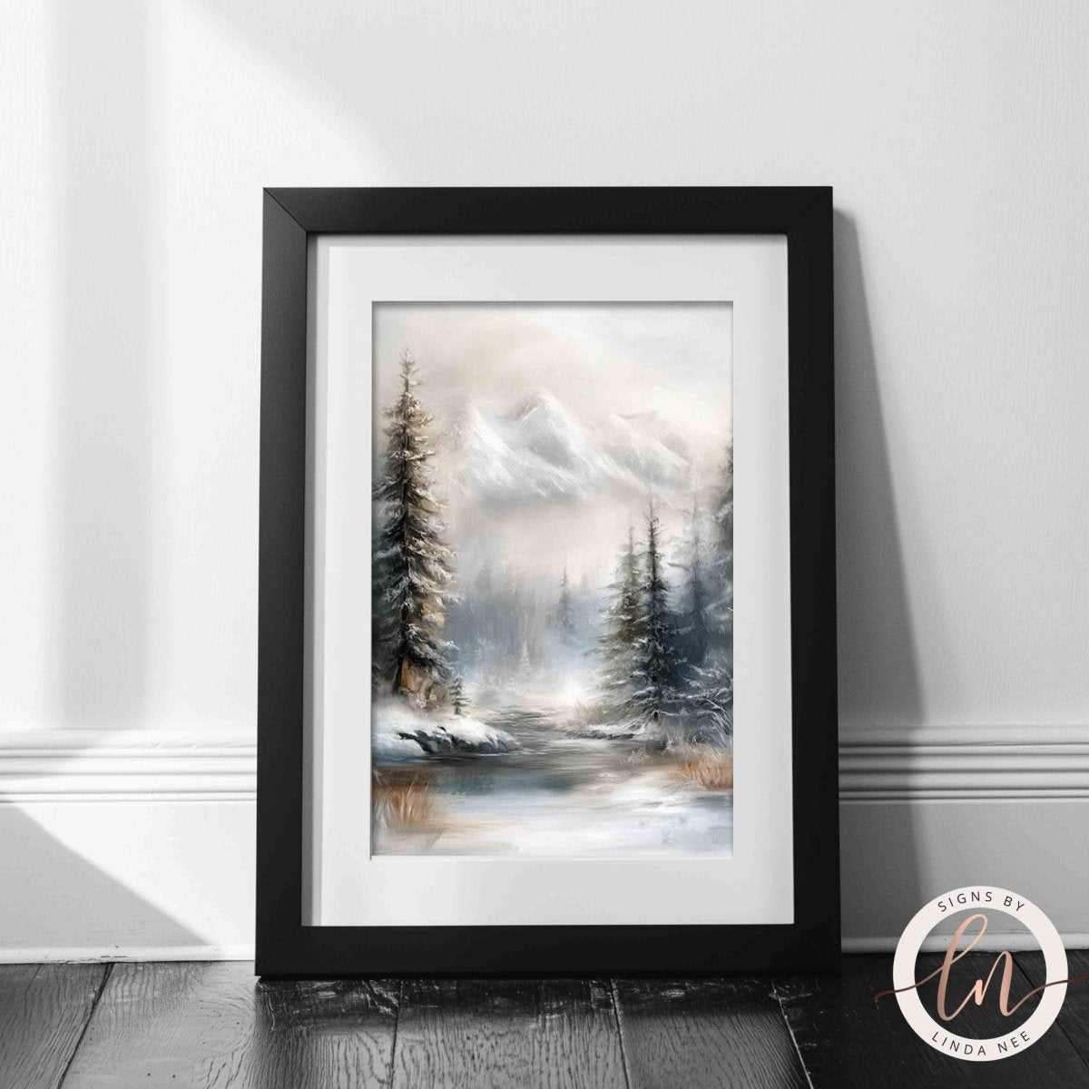 A framed painting depicting a serene winter landscape with snow-covered pine trees and a calm body of water in the foreground.