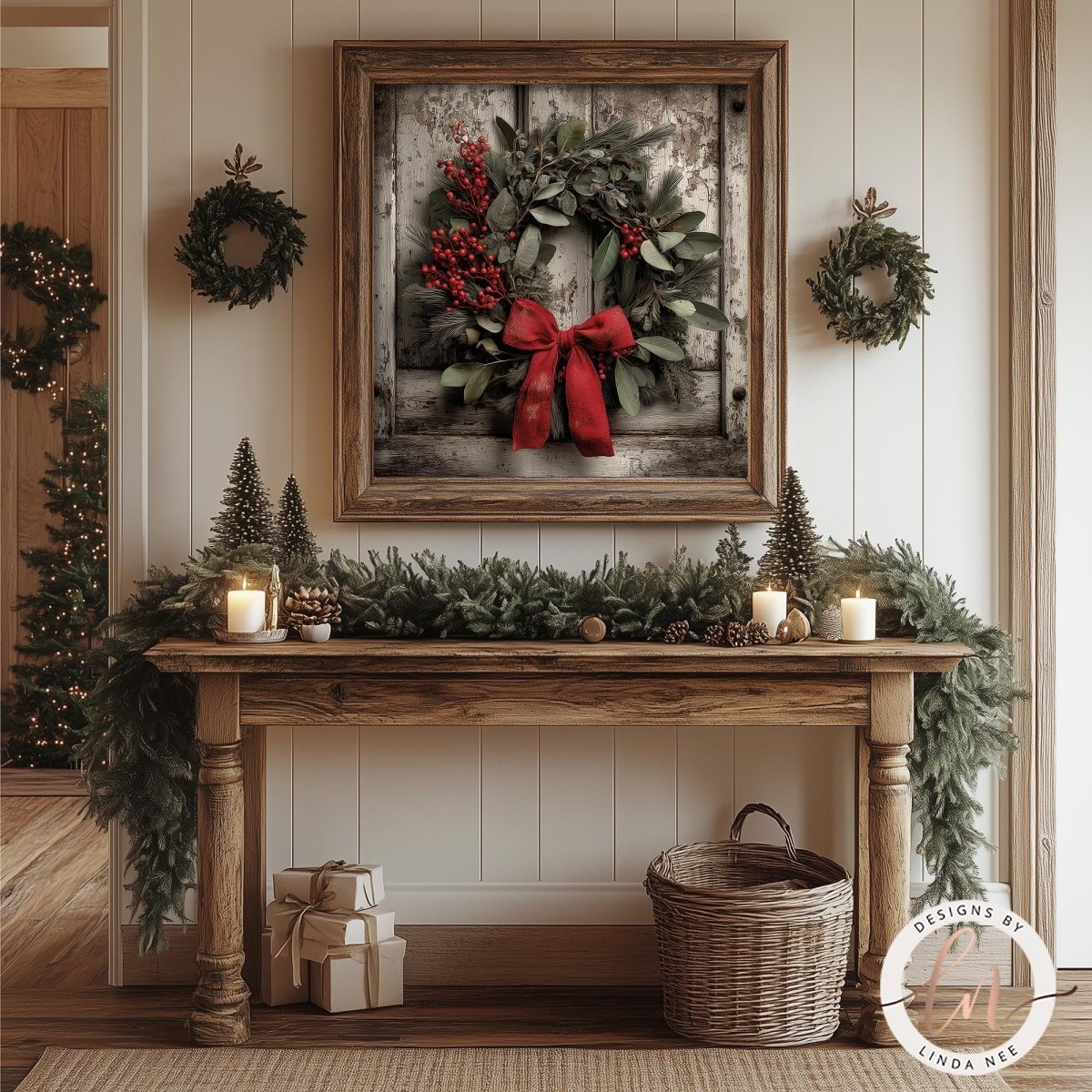 Christmas wreath artwork shown above a rustic console table with candles