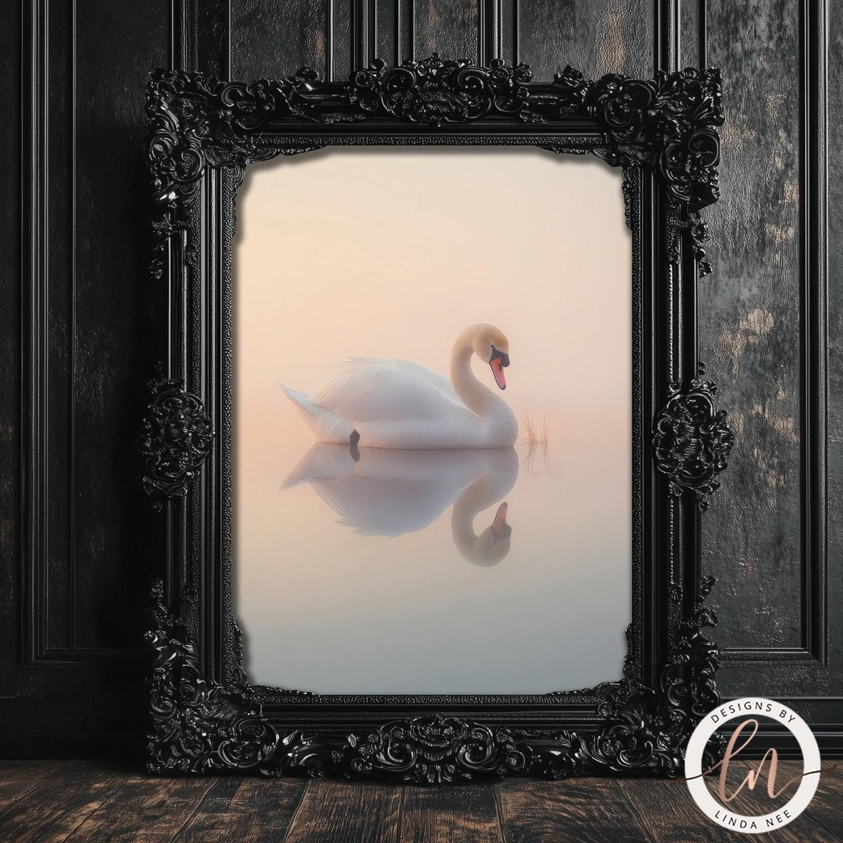 A white swan gracefully floating on a serene body of water, framed in an ornate black frame and displayed on a dark wooden surface.