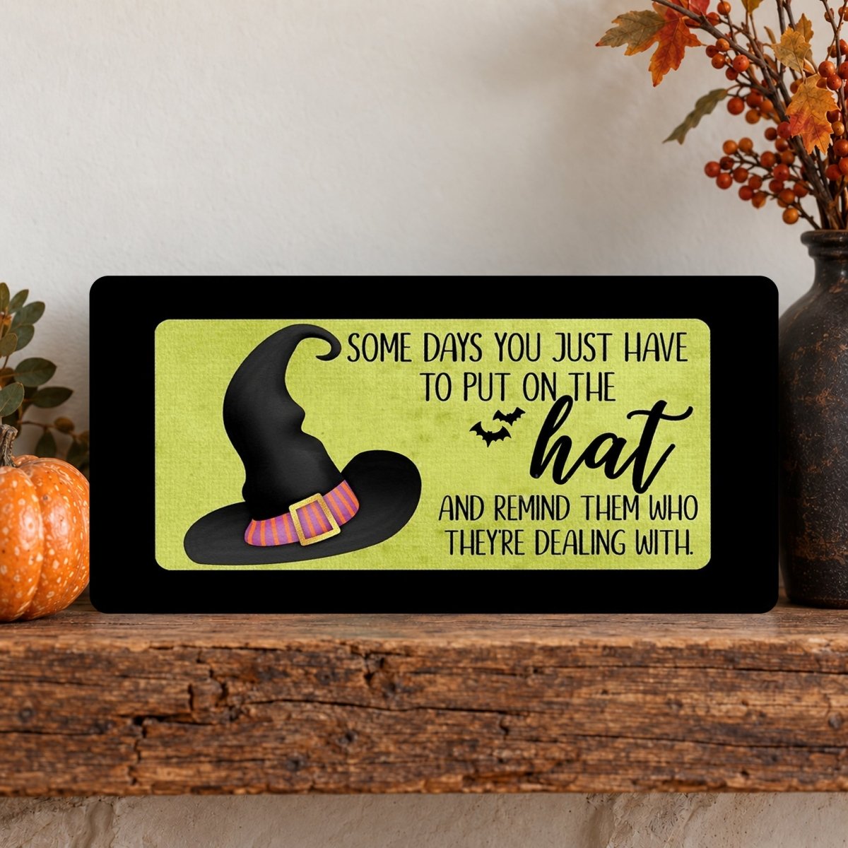 Close view of the Black Put On the Hat sign artwork