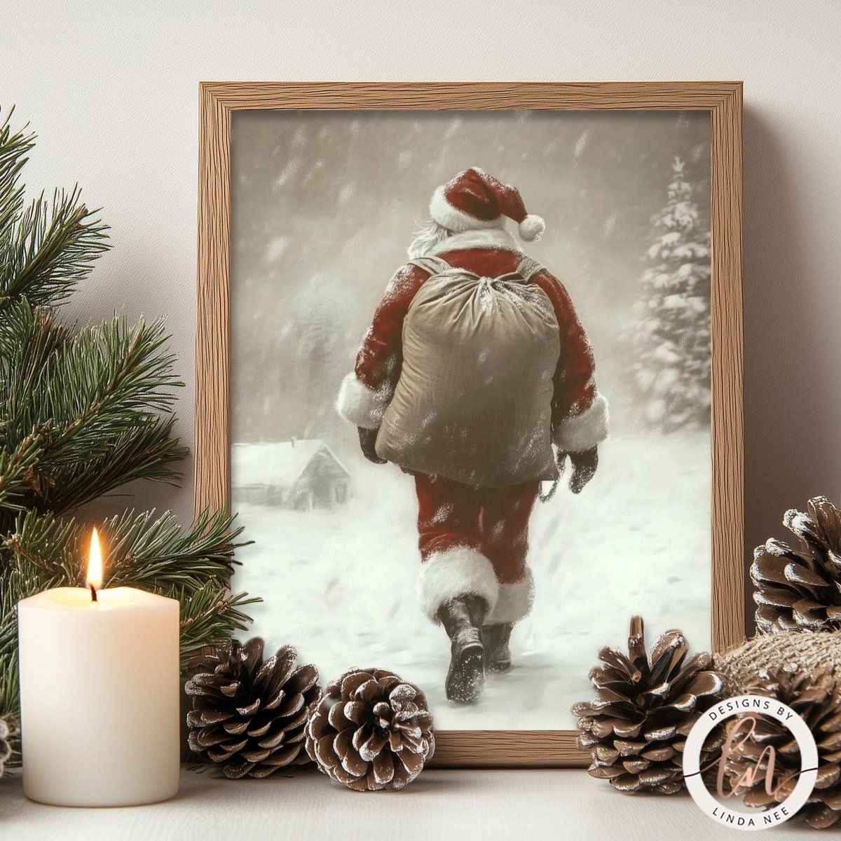 Santa in the snow print styled with a lit candle and pine cones