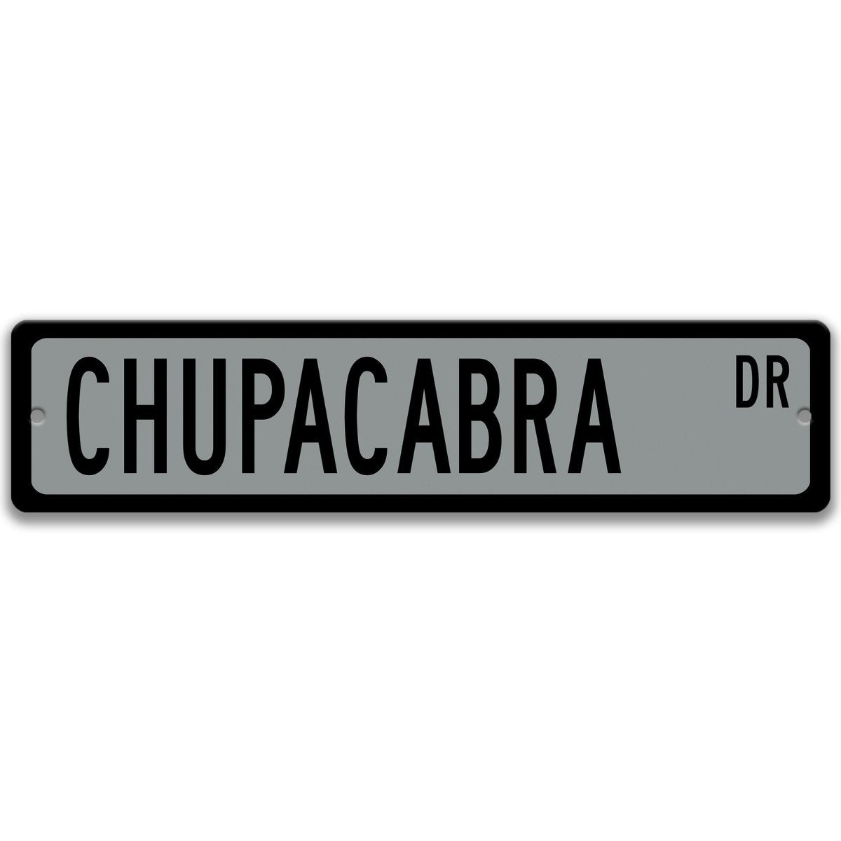 Chupacabra metal street sign with a gray background reading CHUPACABRA DR