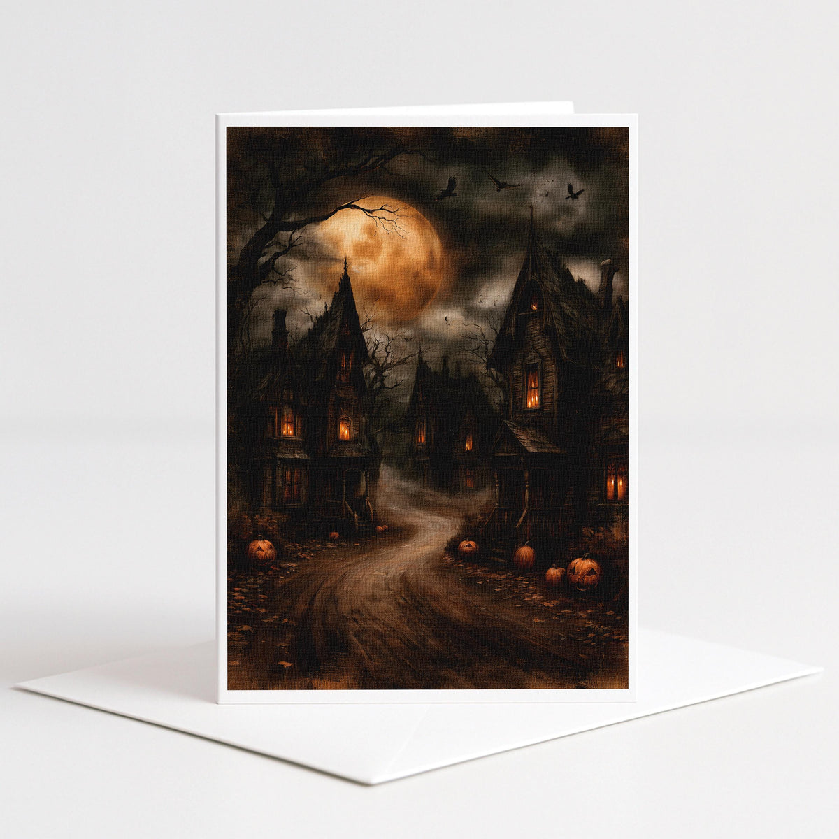 Haunted village of crooked houses under a glowing harvest moon, 5x7 blank note card