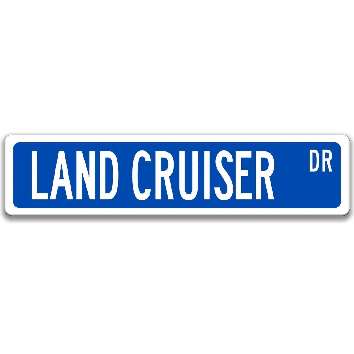 Blue street sign with white border, white text reading LAND CRUISER DR