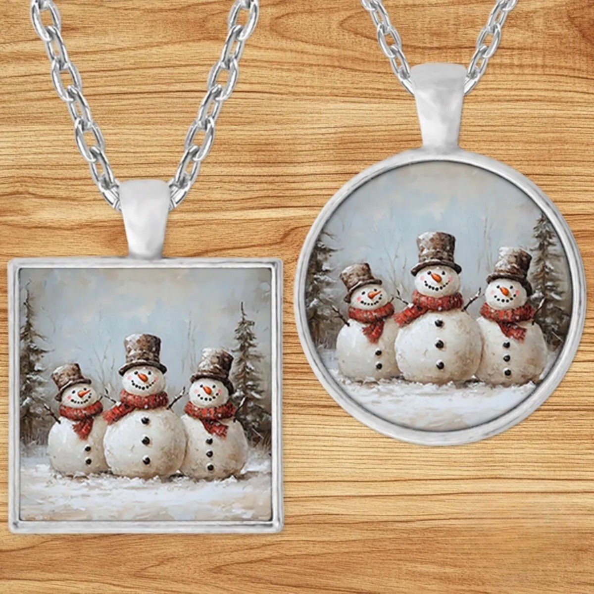 Three Snowmen Vintage Christmas pendant necklace shown in round and square silver charm styles on a wood background